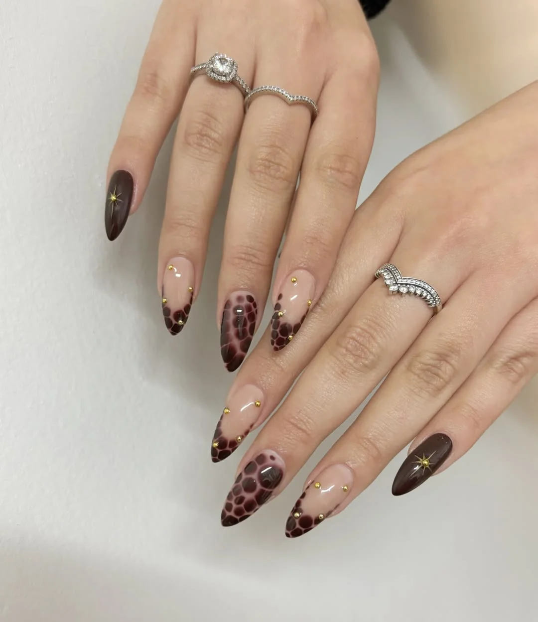 fall nail trends 2026 Mocha Tortoiseshell French Nails With Gold Stud Details