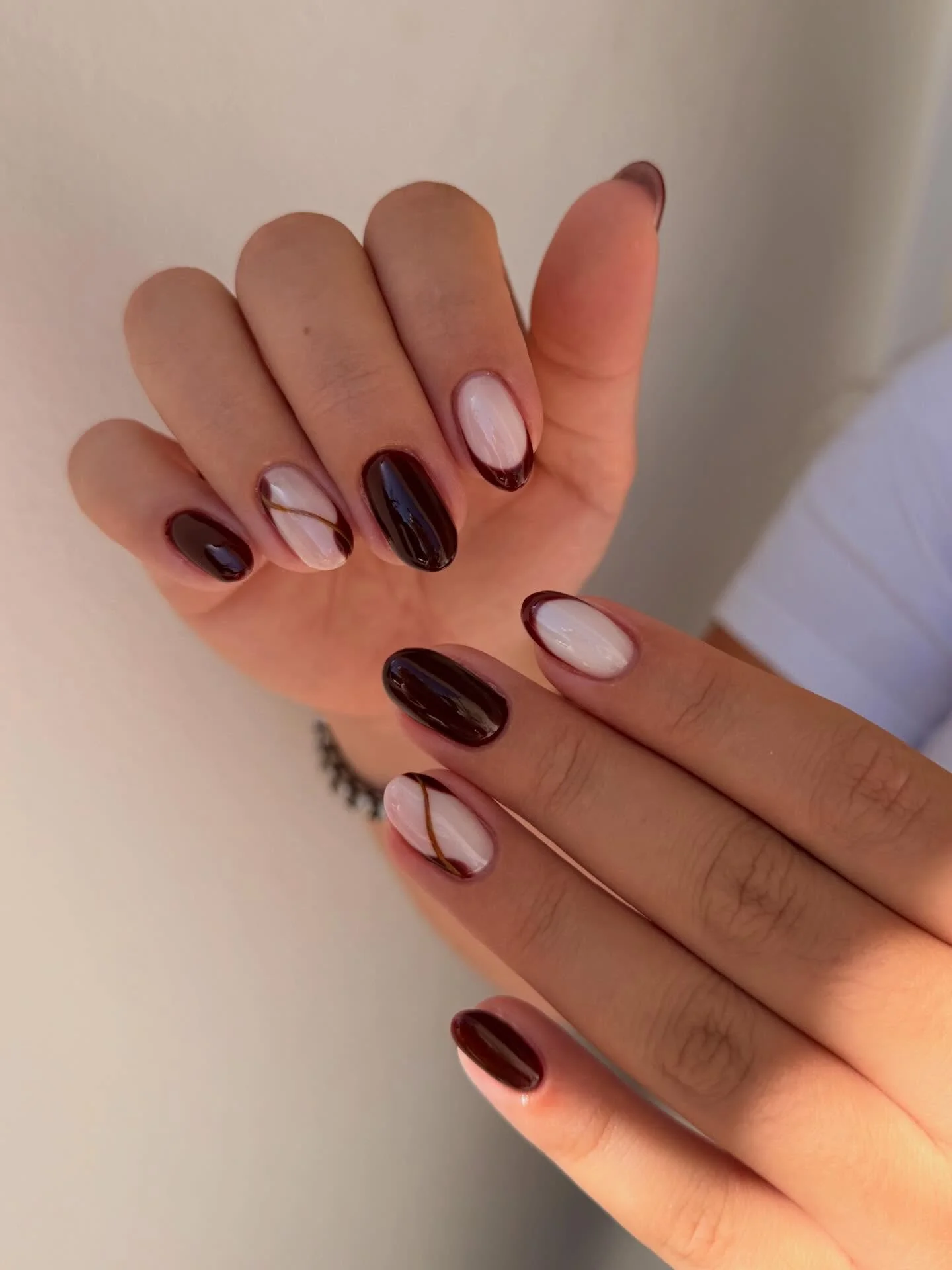 fall short almond nails 2026 Deep Espresso Nails With Minimal Gold Line Art