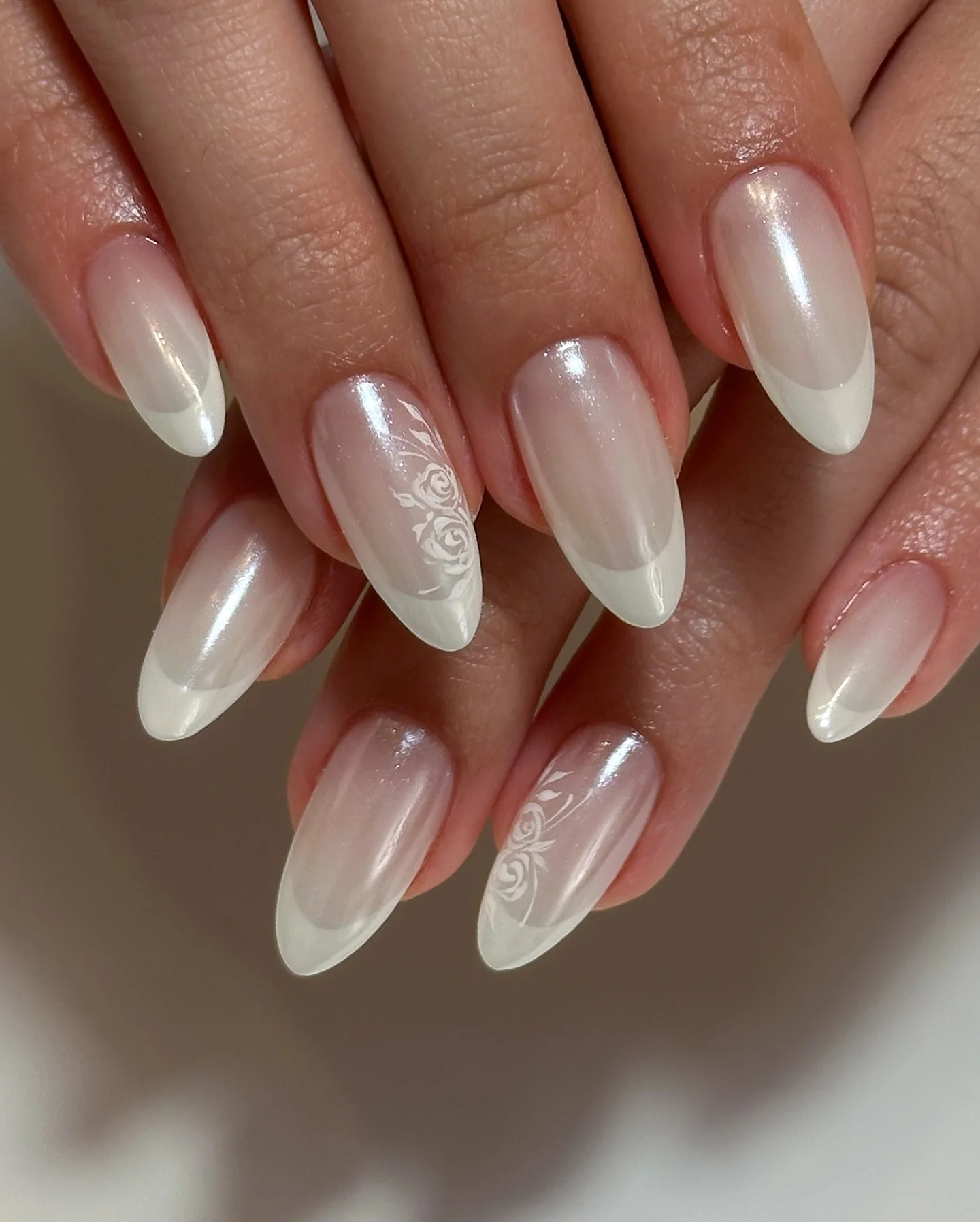 fall wedding nails 2026 Pearl French Almond Nails With Delicate Rose Details
