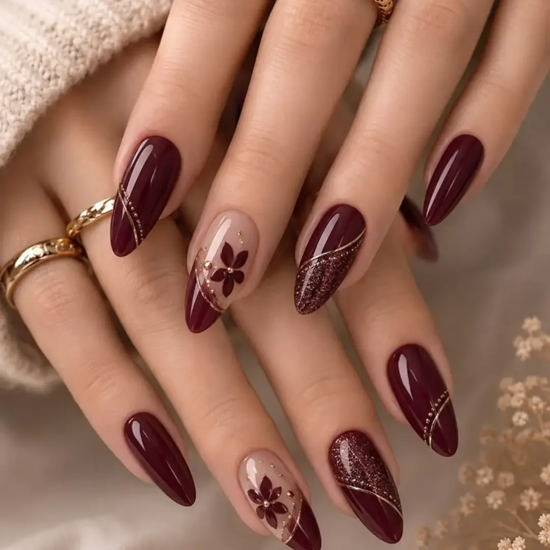 fall nail trends 2026 Elegant Burgundy Floral Almond Nails With Glitter Accent