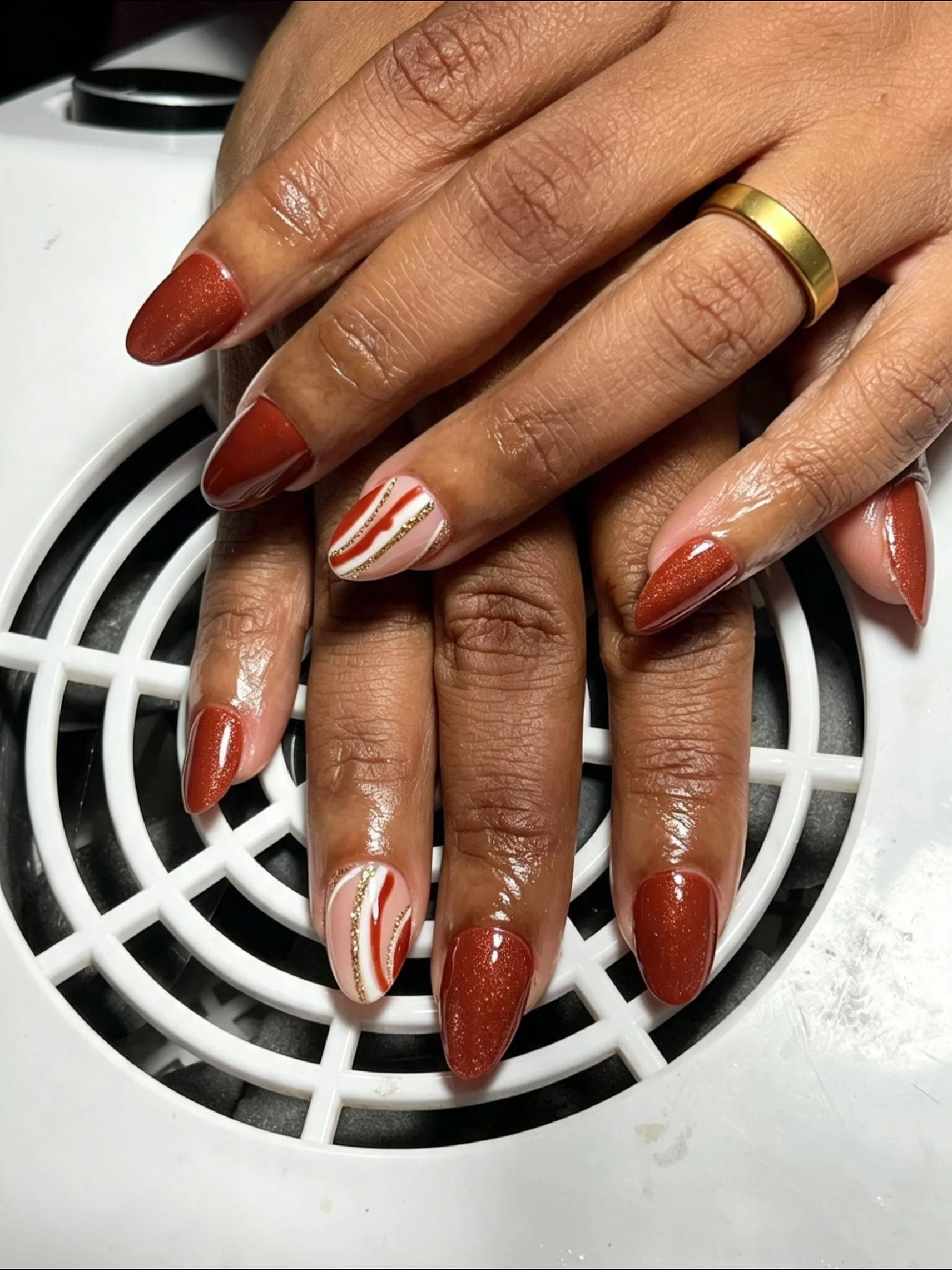 fall nails for brown skin tone Rust Red Almond Nails With Delicate Cream And Gold Lines
