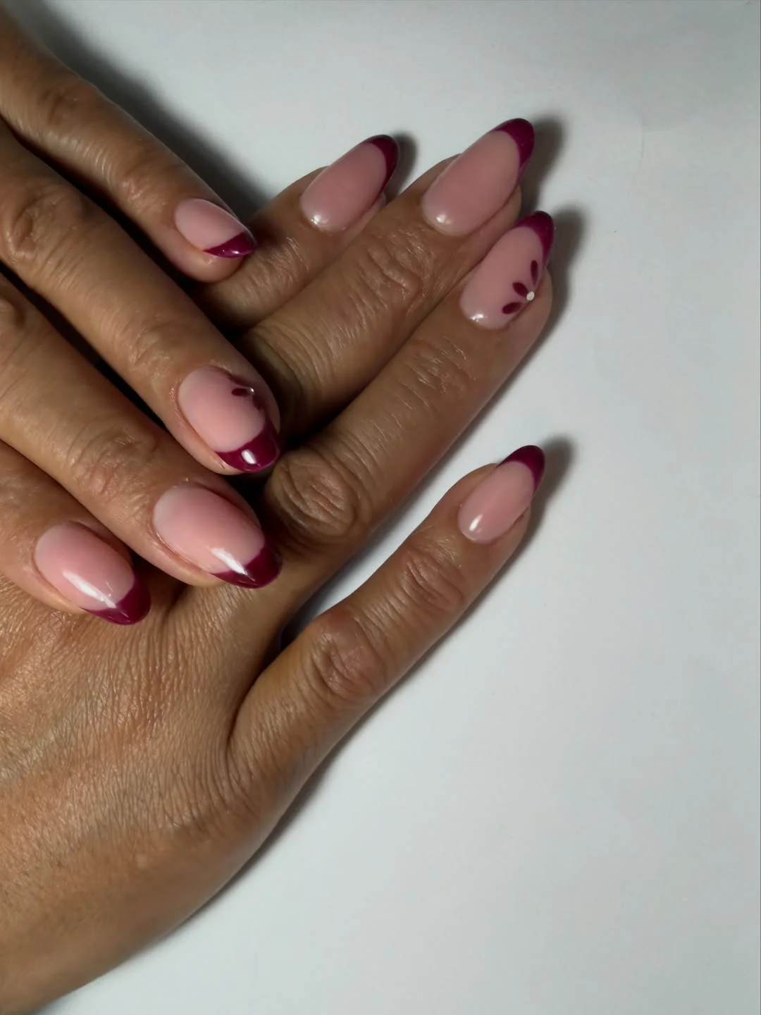fall short almond nails 2026 Berry French Tips With Sweet Floral Details