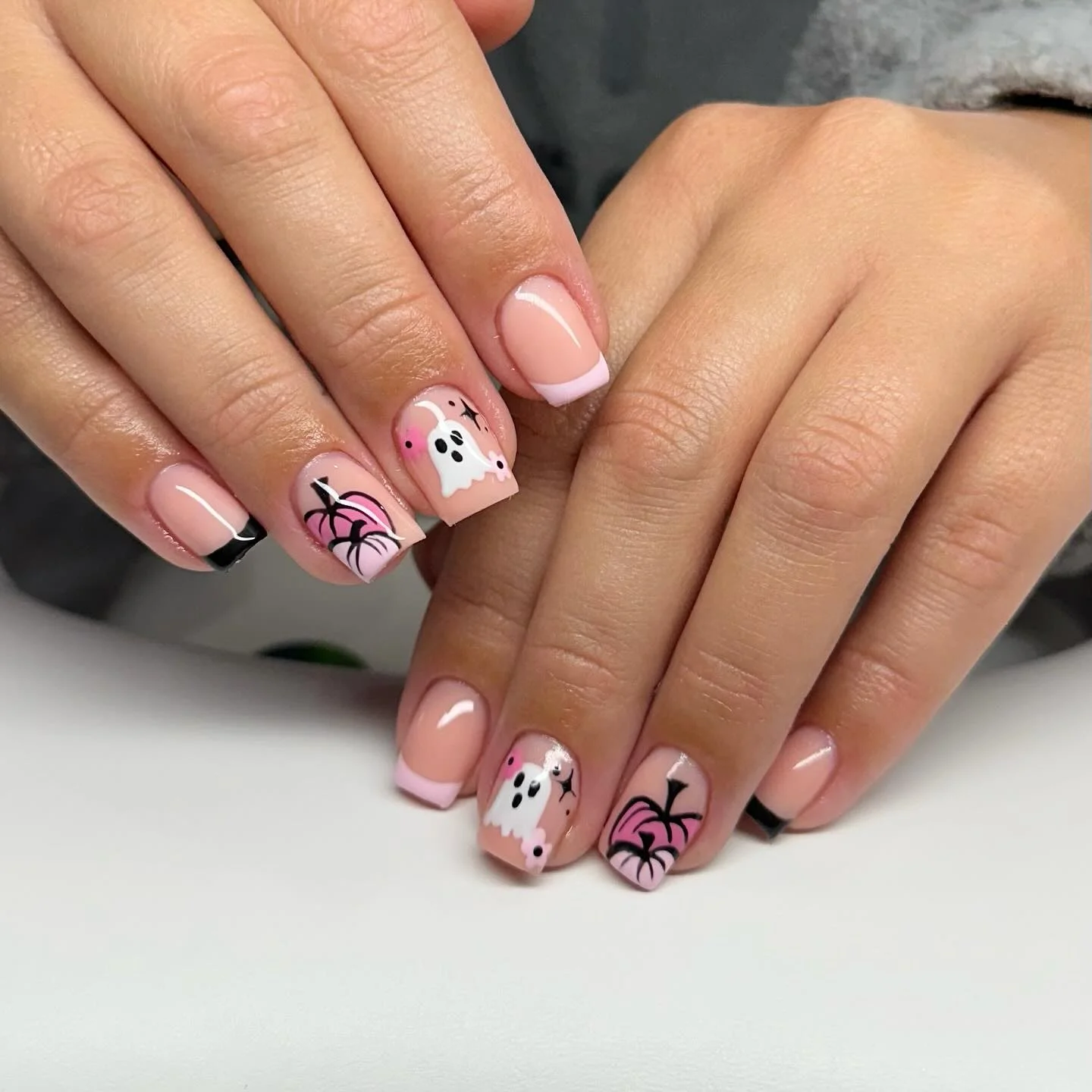 halloween nail art 2026 Soft Pink French With Mini Ghosts And Pumpkins