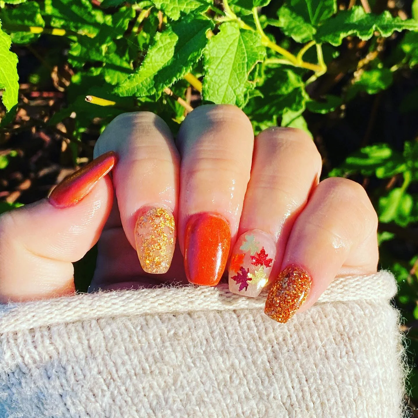fall dip nails 2026 Warm Orange Glitter And Autumn Leaf Accents