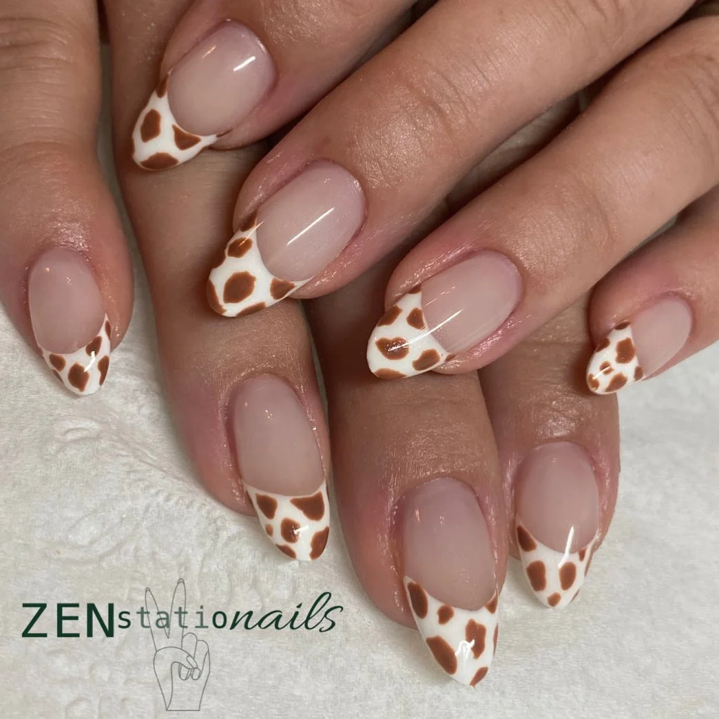 fall french nails 2026 Cow Print French Tips With Soft Mocha Accents