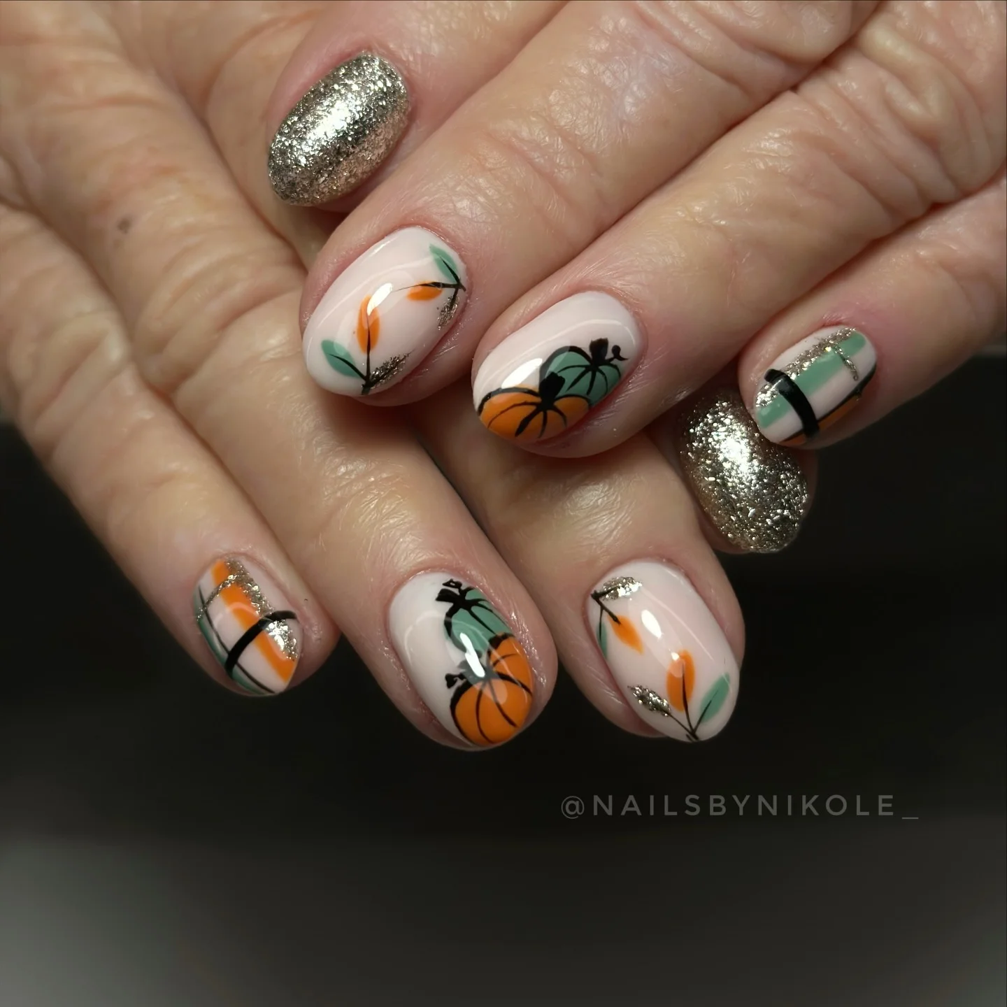 fall nail inspiration 2026 Playful Pumpkin And Glitter Accent Nails