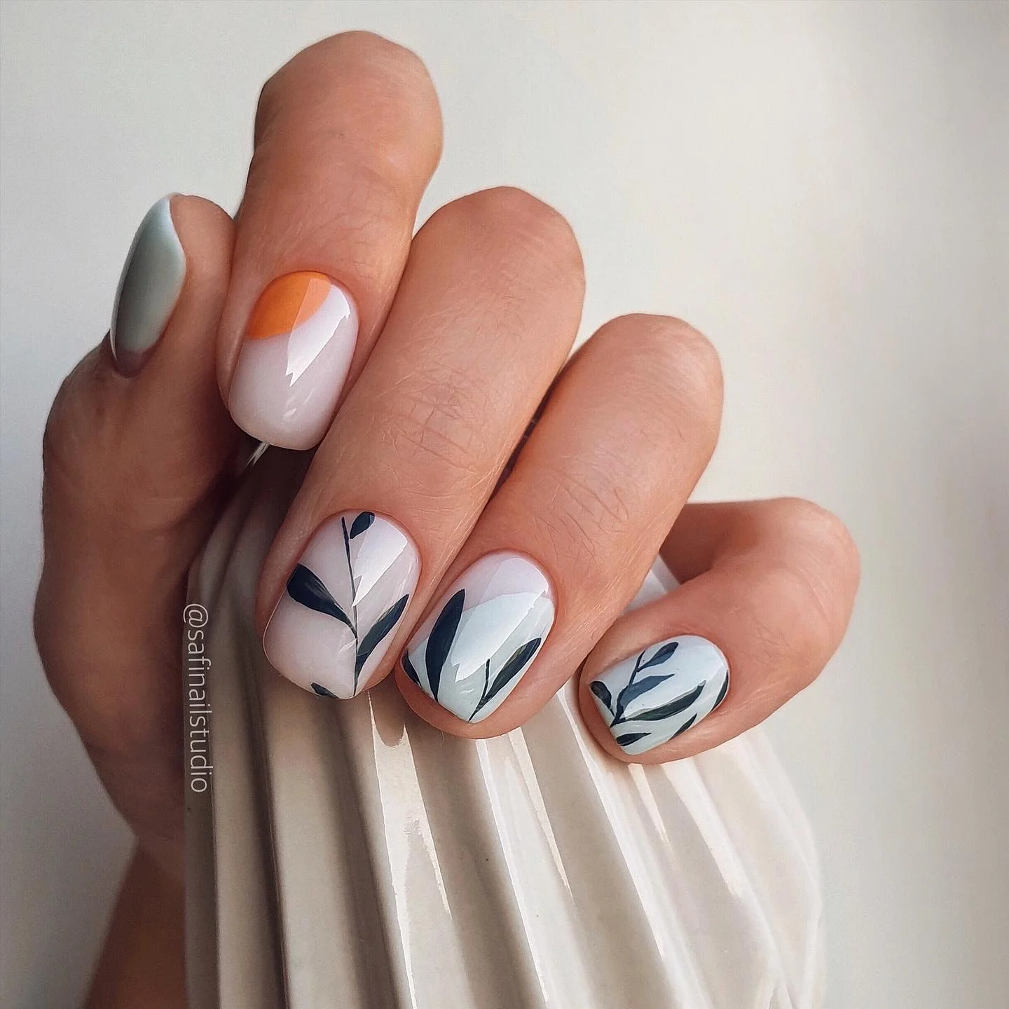 fall nails for olive skin tone 2026 Soft White And Minimal Botanical Accents