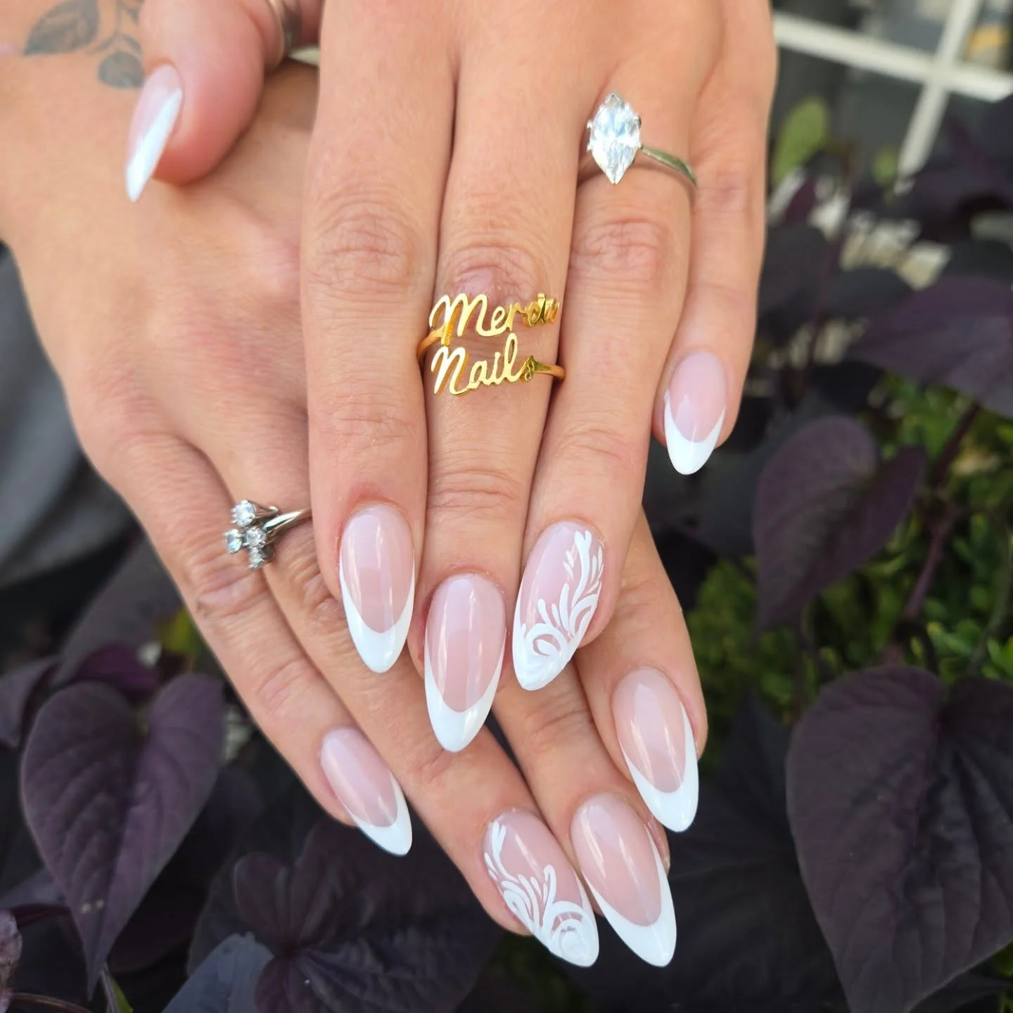 fall wedding nails 2026 Elegant Almond French Tips With Botanical White Accents