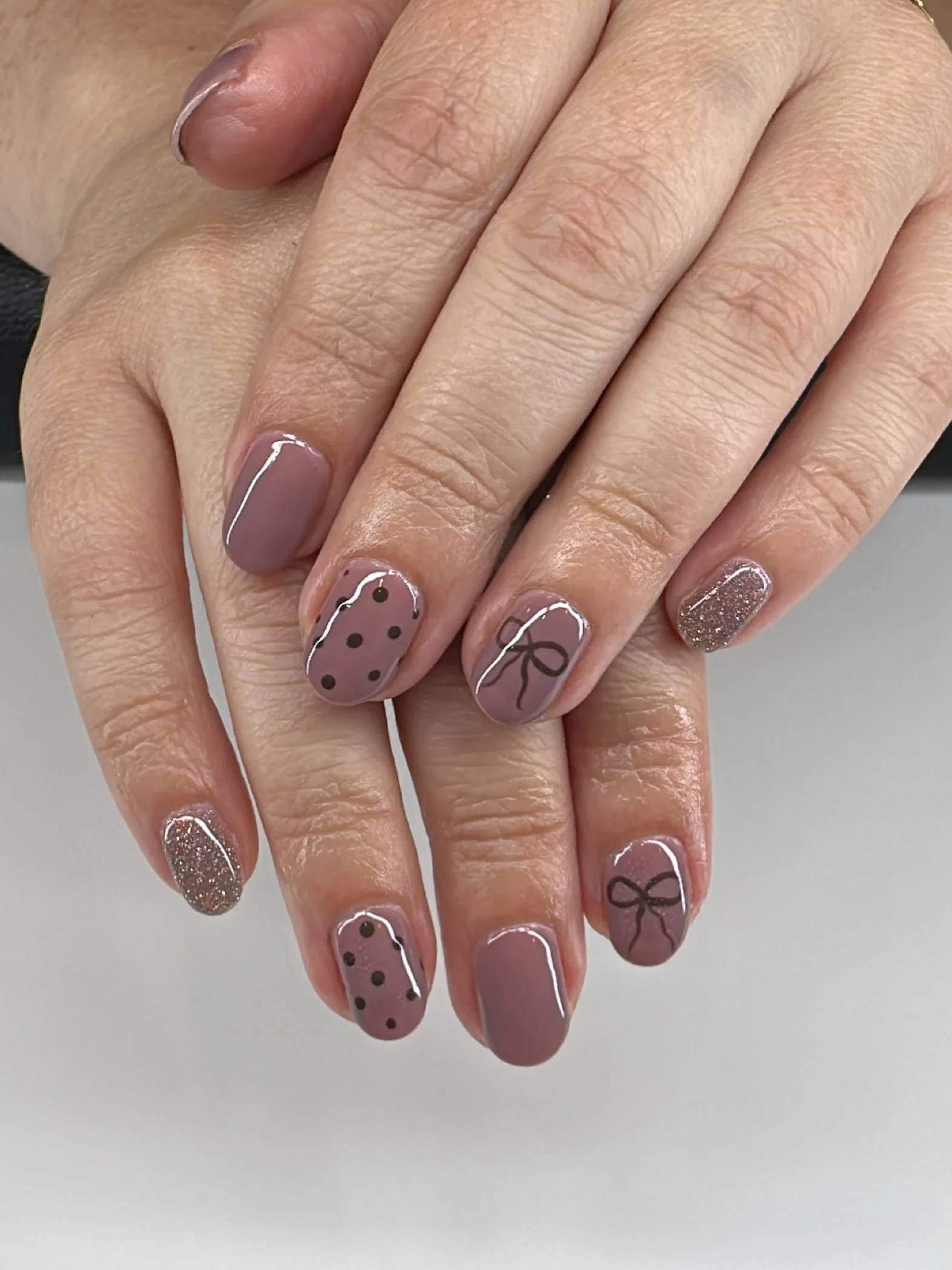 polka dot fall nails 2026 Mauve Dots With Delicate Bow Details
