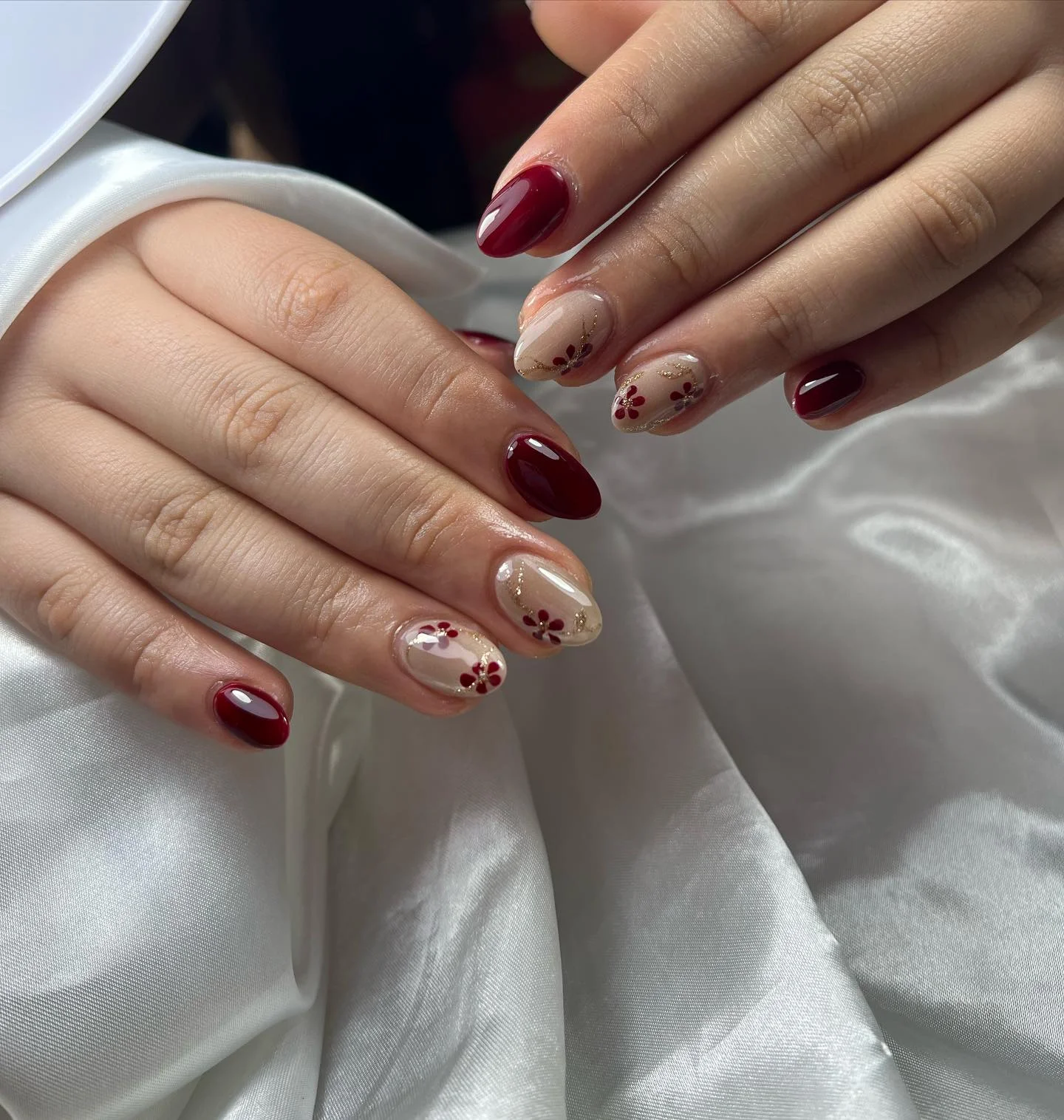 fall burgundy nails with design Short Burgundy Nails With Tiny Gold Floral Details