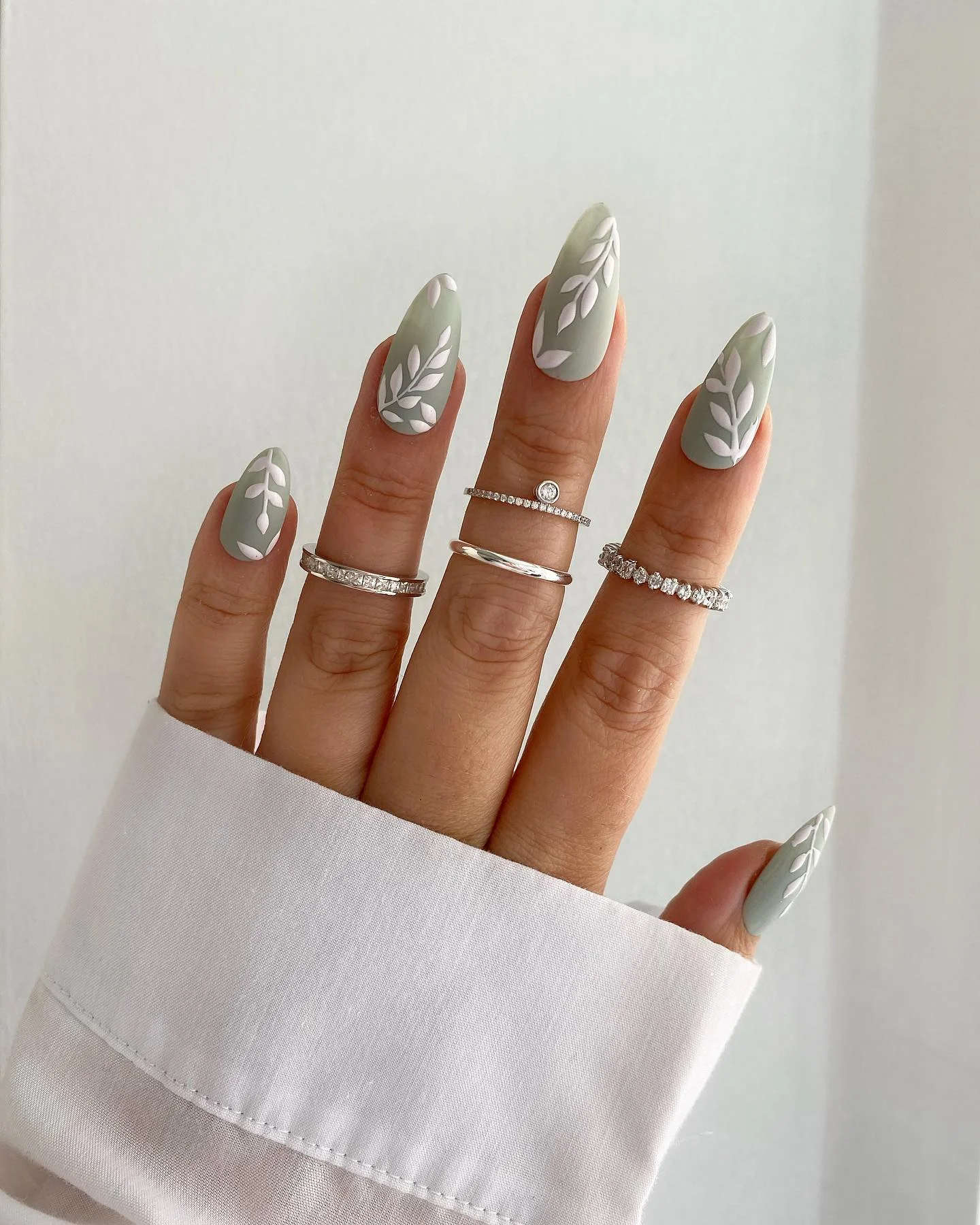 matte fall nails design 2026 Sage Green And Raised Botanical Leaves