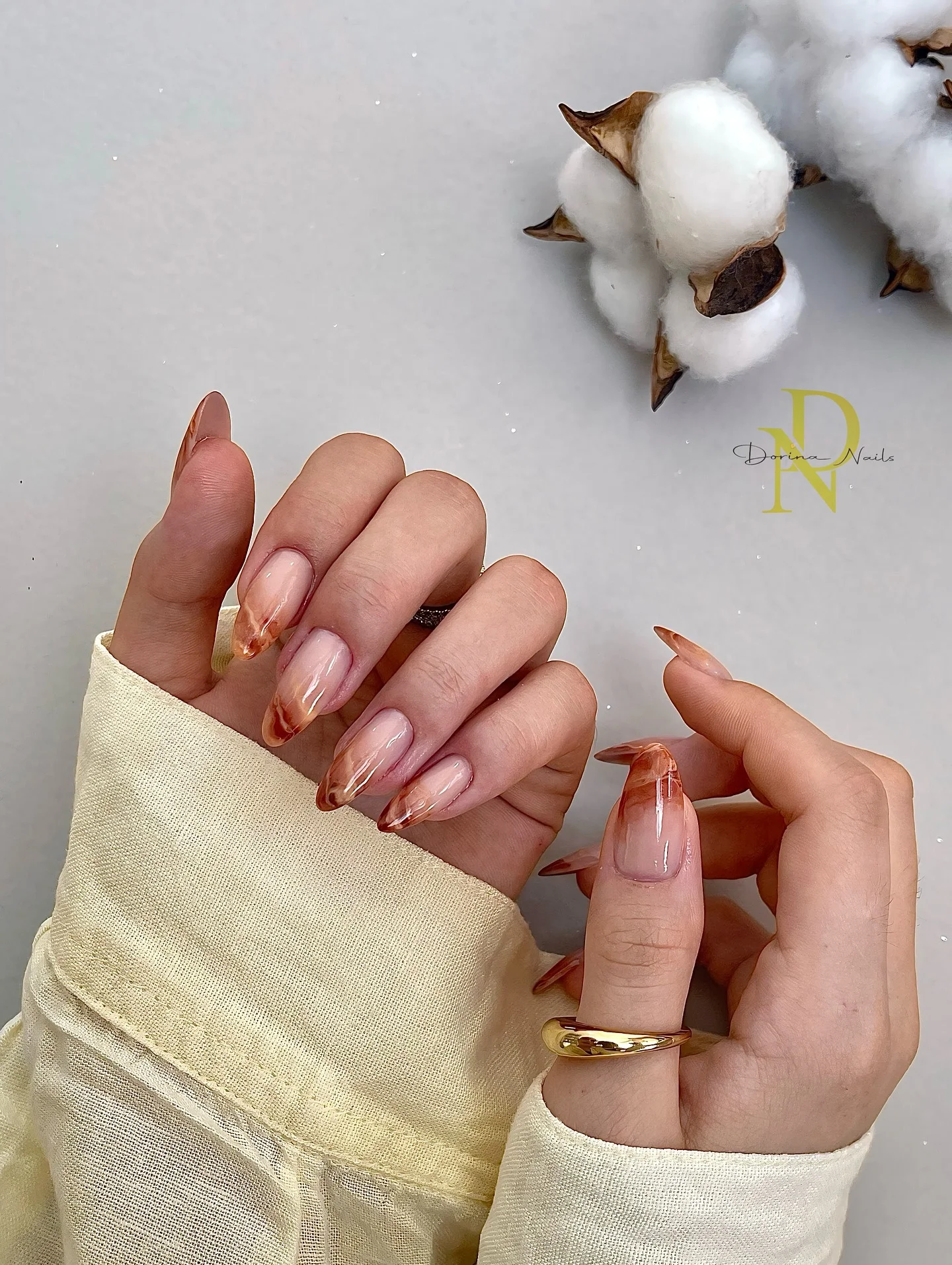 early fall nails 2026 Glossy Amber Marble Almond Nails