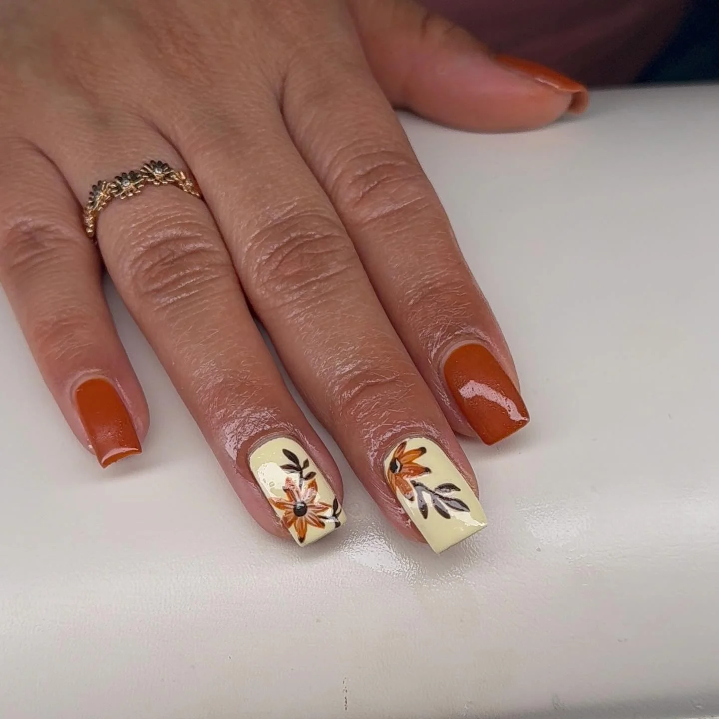 fall nail inspiration 2026 Rust And Cream Floral Nails With Vintage Charm