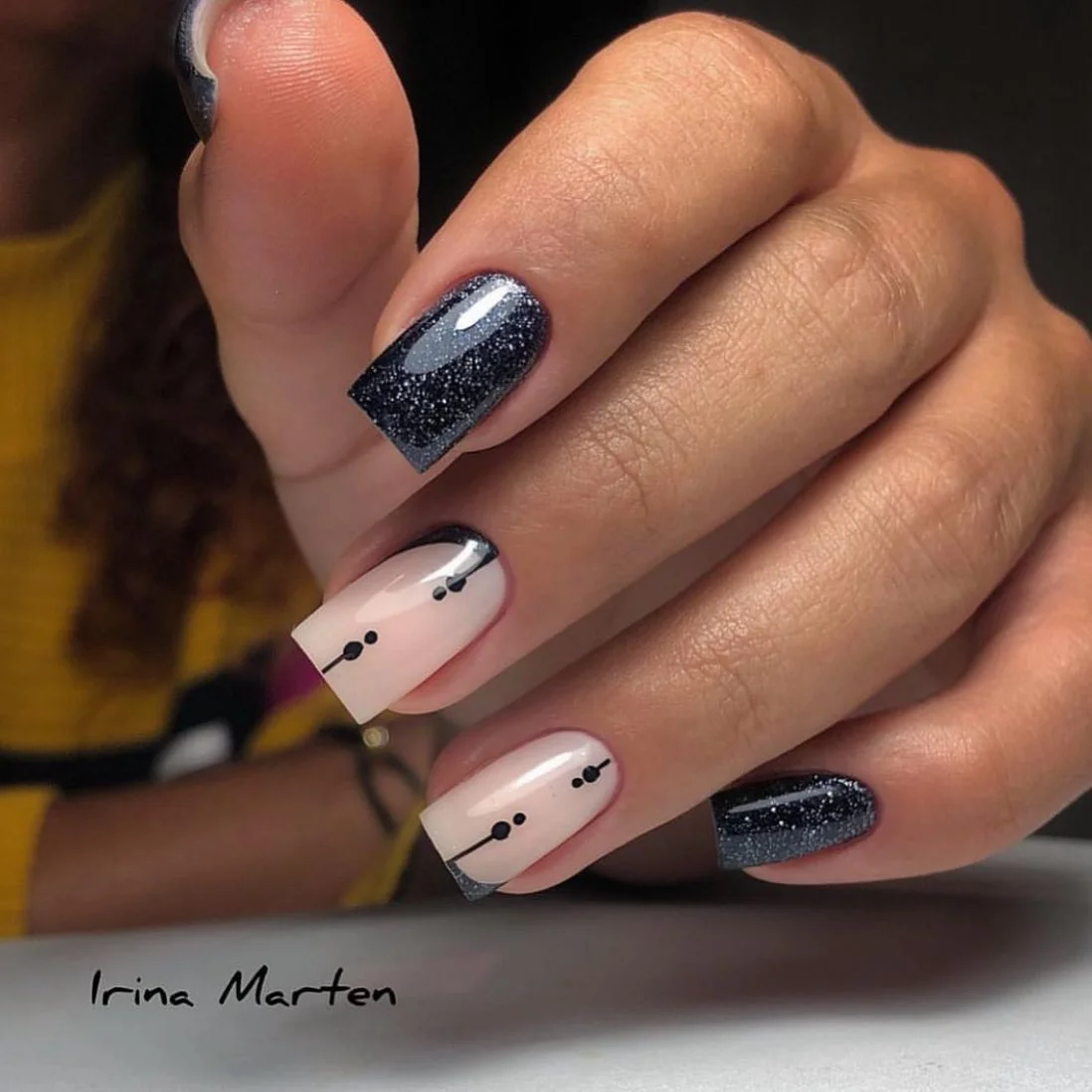 fall nails for olive skin tone 2026 Black Glitter And Soft Nude Graphic Details
