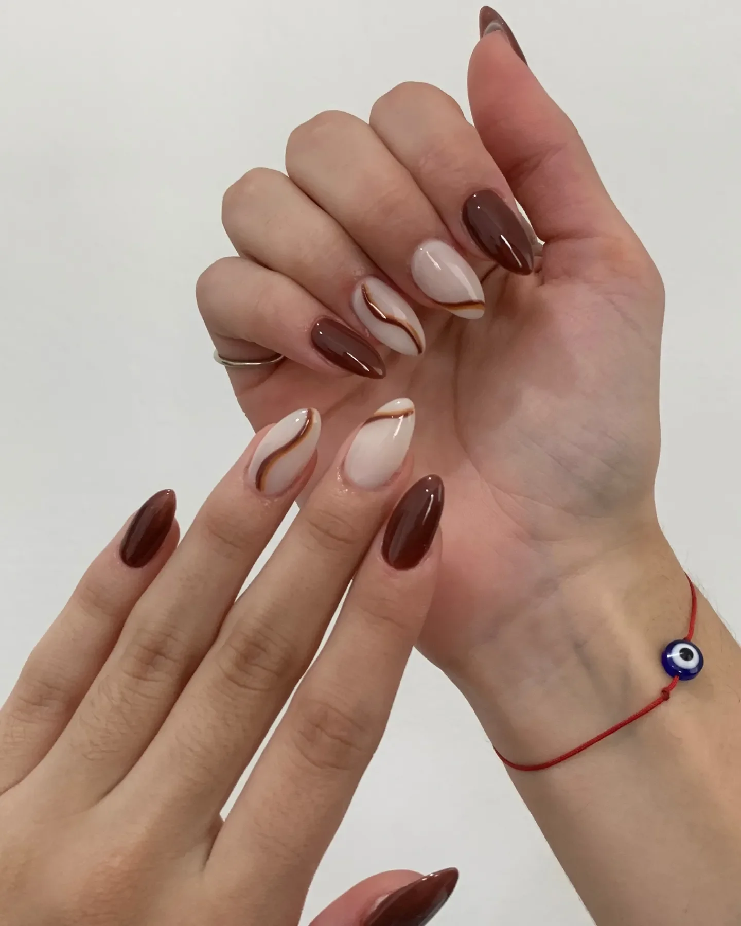 fall gel nails ideas 2026 Soft Mocha Swirls For Elegant Almond Nails