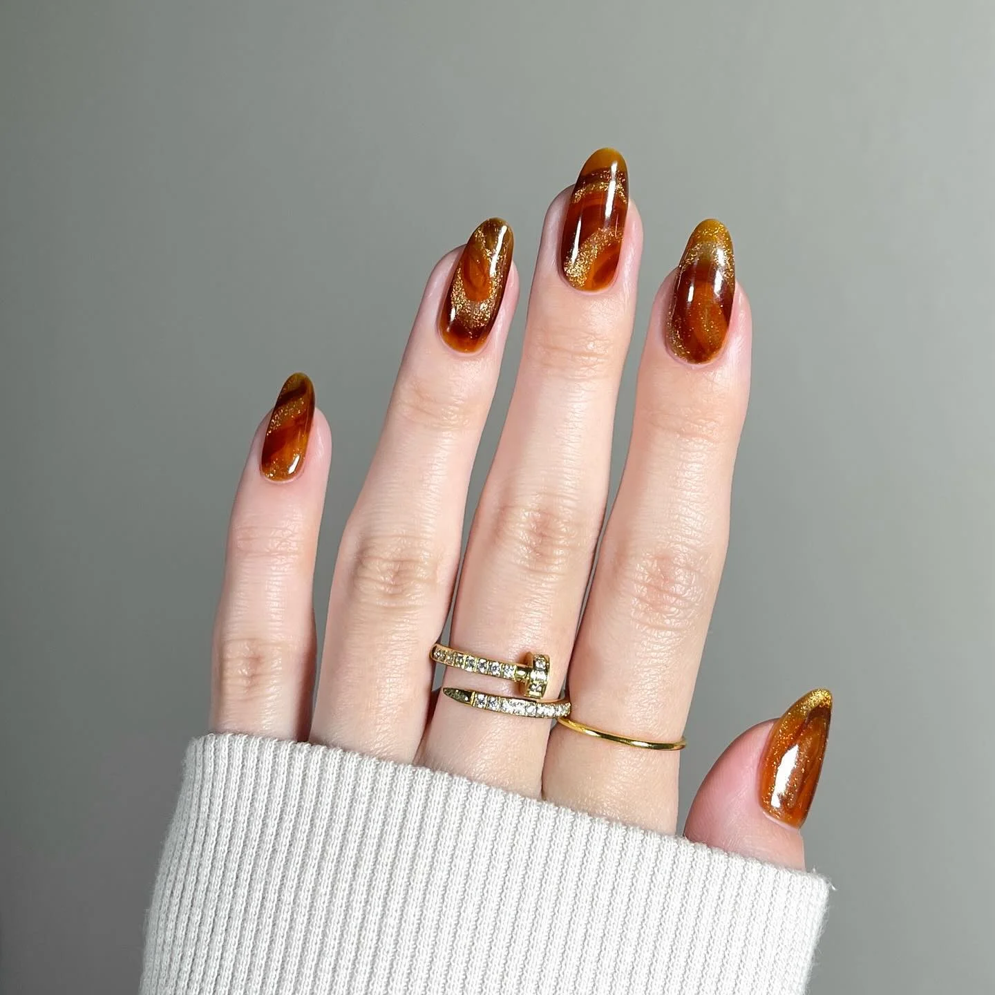 fall nails for pale skin 2026 Glossy Amber Tortoiseshell With Golden Sparkle