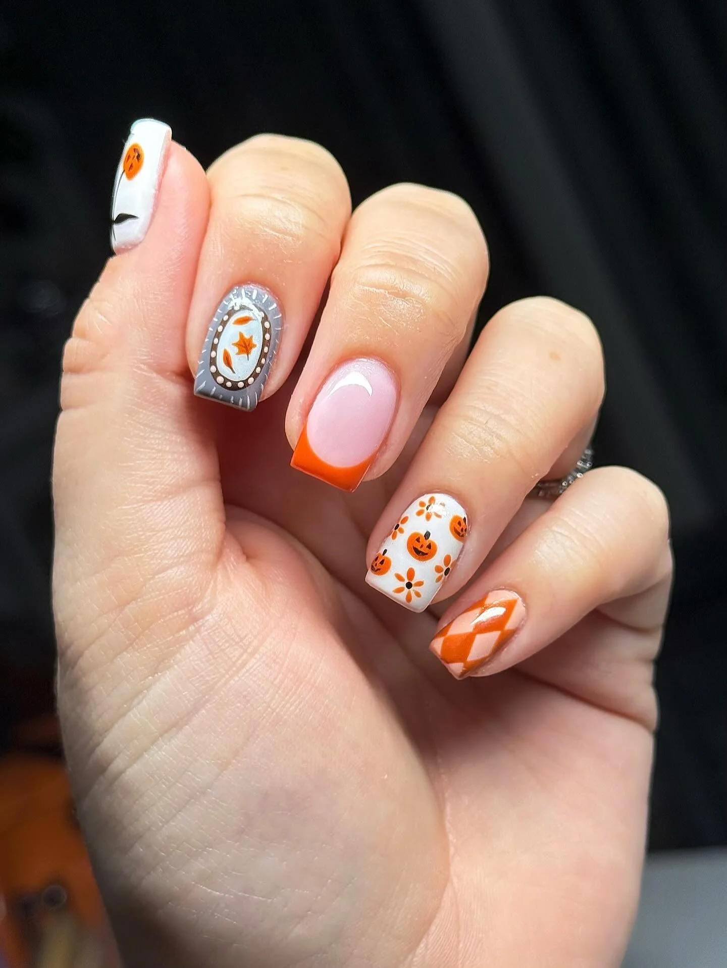 halloween nail art 2026 Soft Pink French With Tiny Halloween Accents