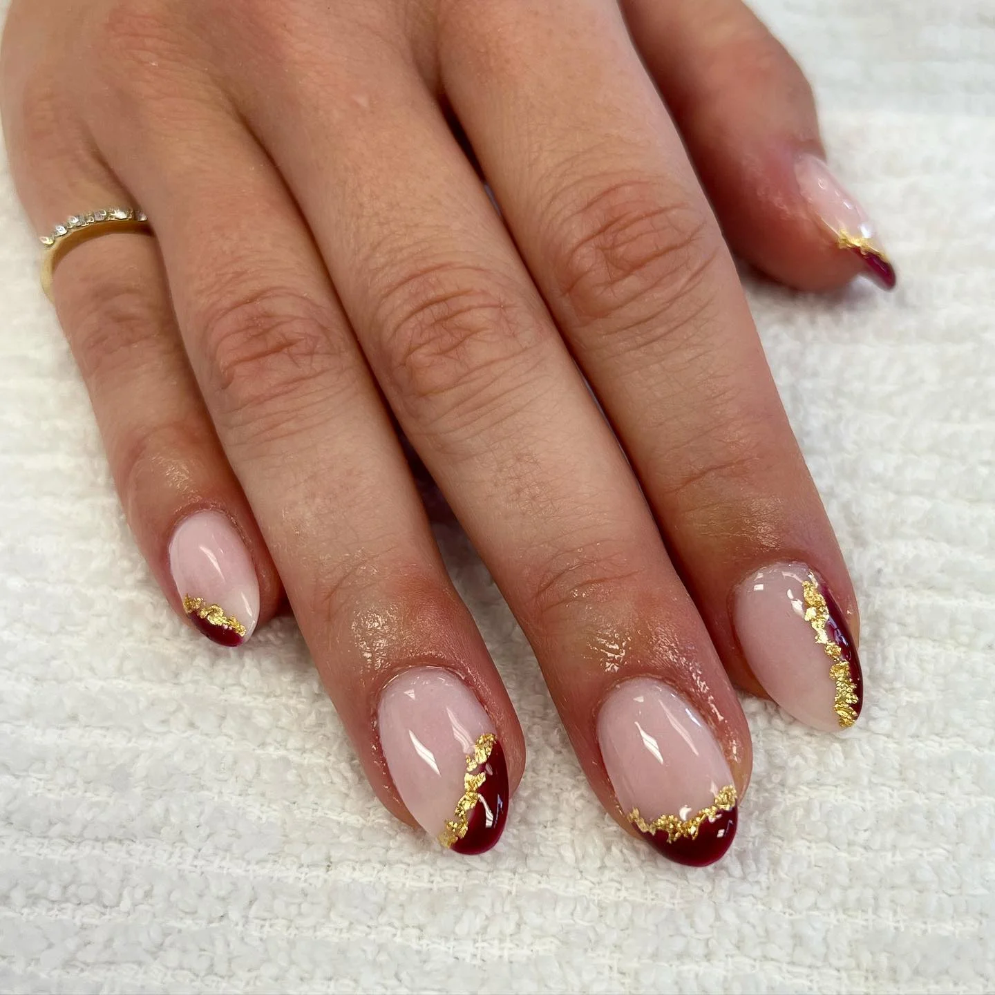 fall dip nails 2026 Burgundy French Tips With Gold Foil Details
