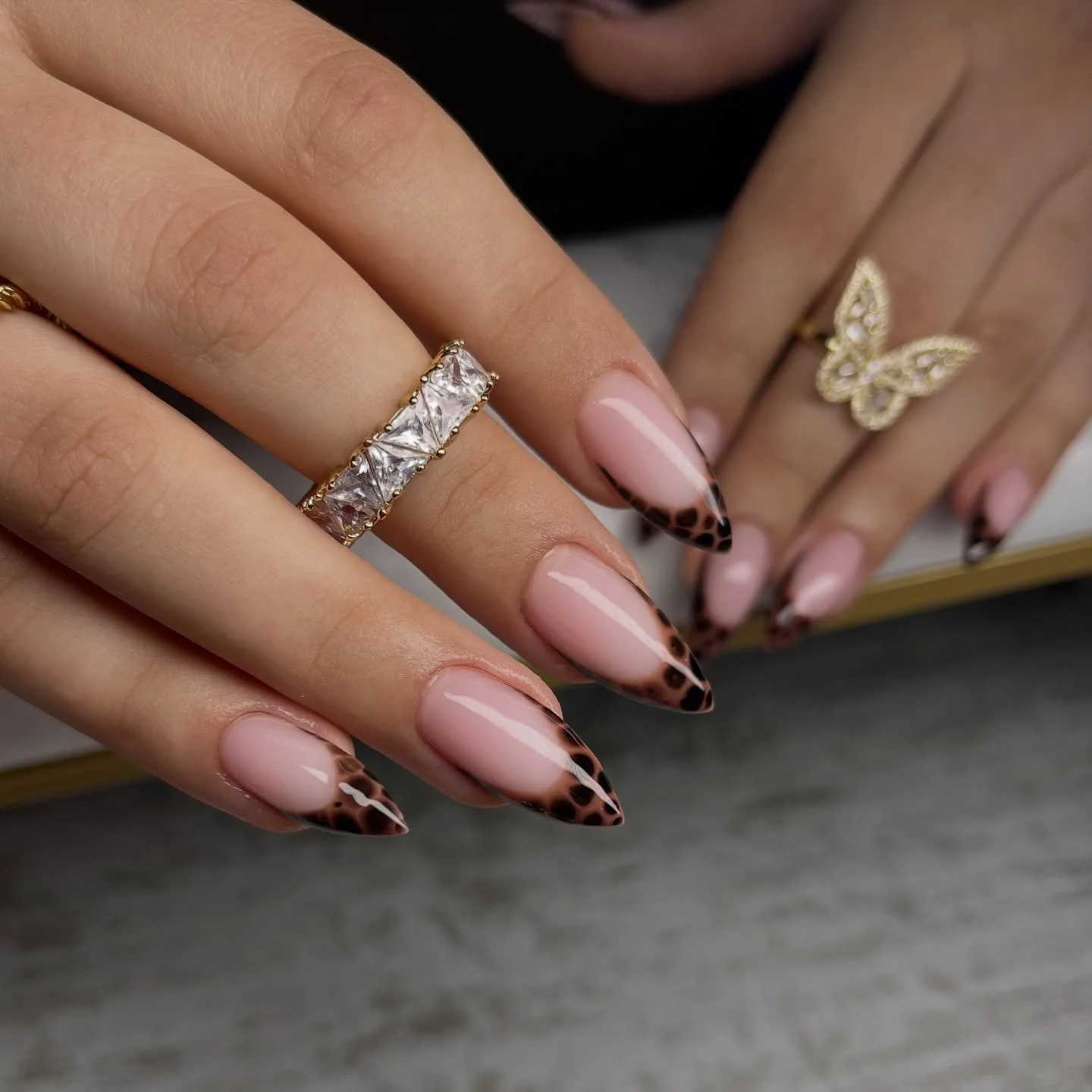 fall french nails 2026 Leopard French Almond Tips With Soft Nude Base