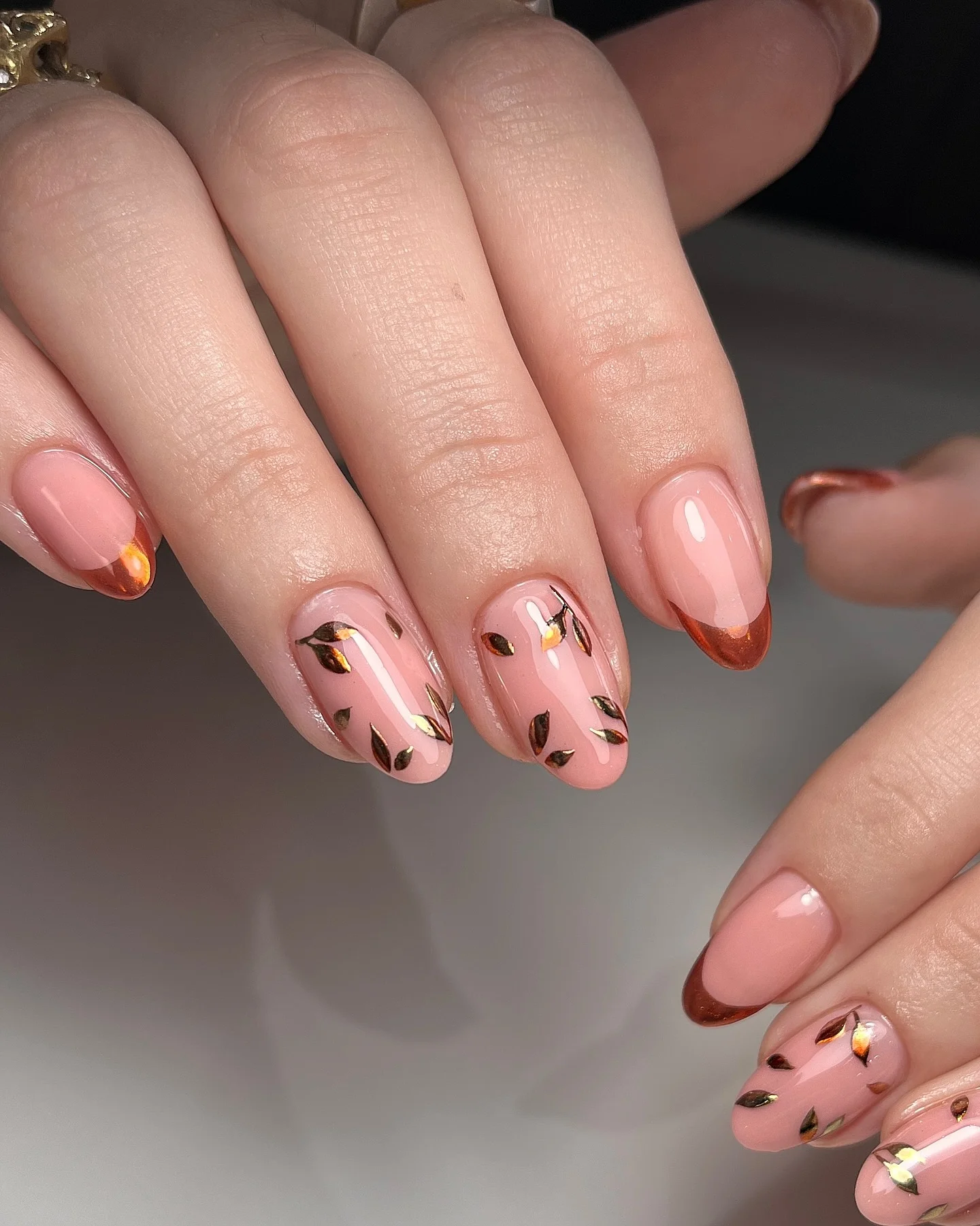 fall nail inspiration 2026 Copper French Tips With Delicate Metallic Leaves