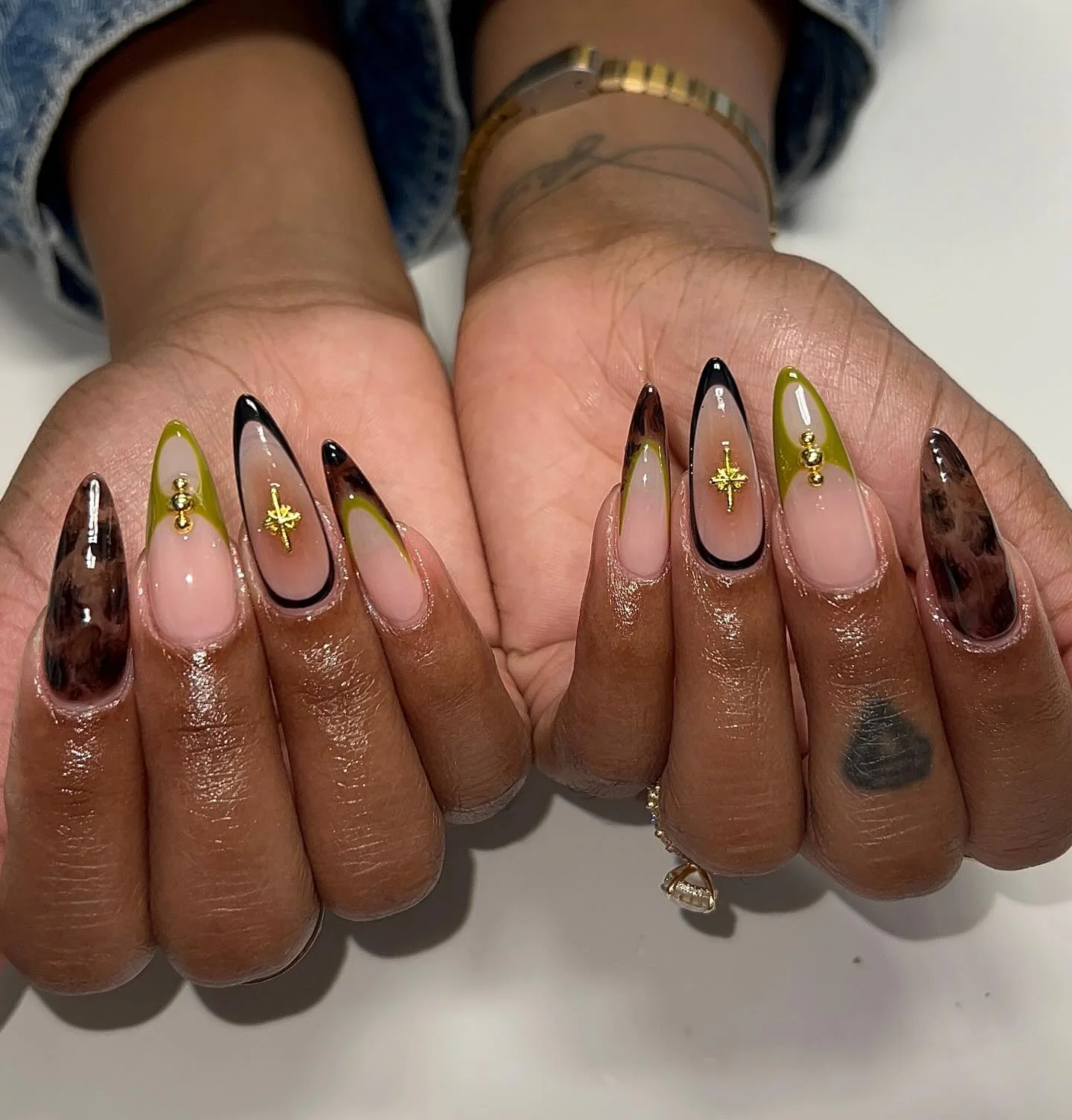 fall nails for brown skin tone Olive Green And Espresso Almond Nails With Gold Charms