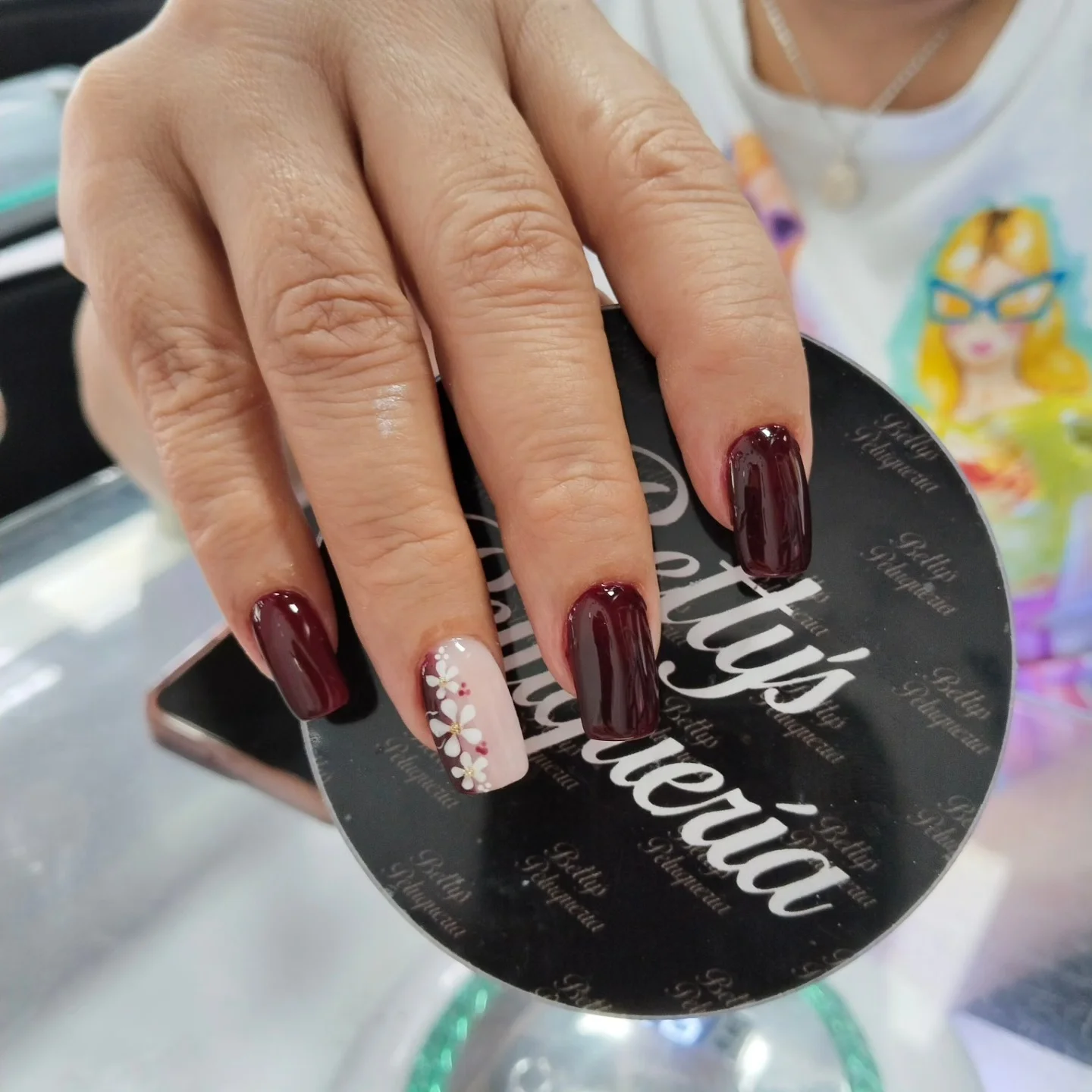 fall burgundy nails with design Deep Burgundy With White Floral Accent Nail