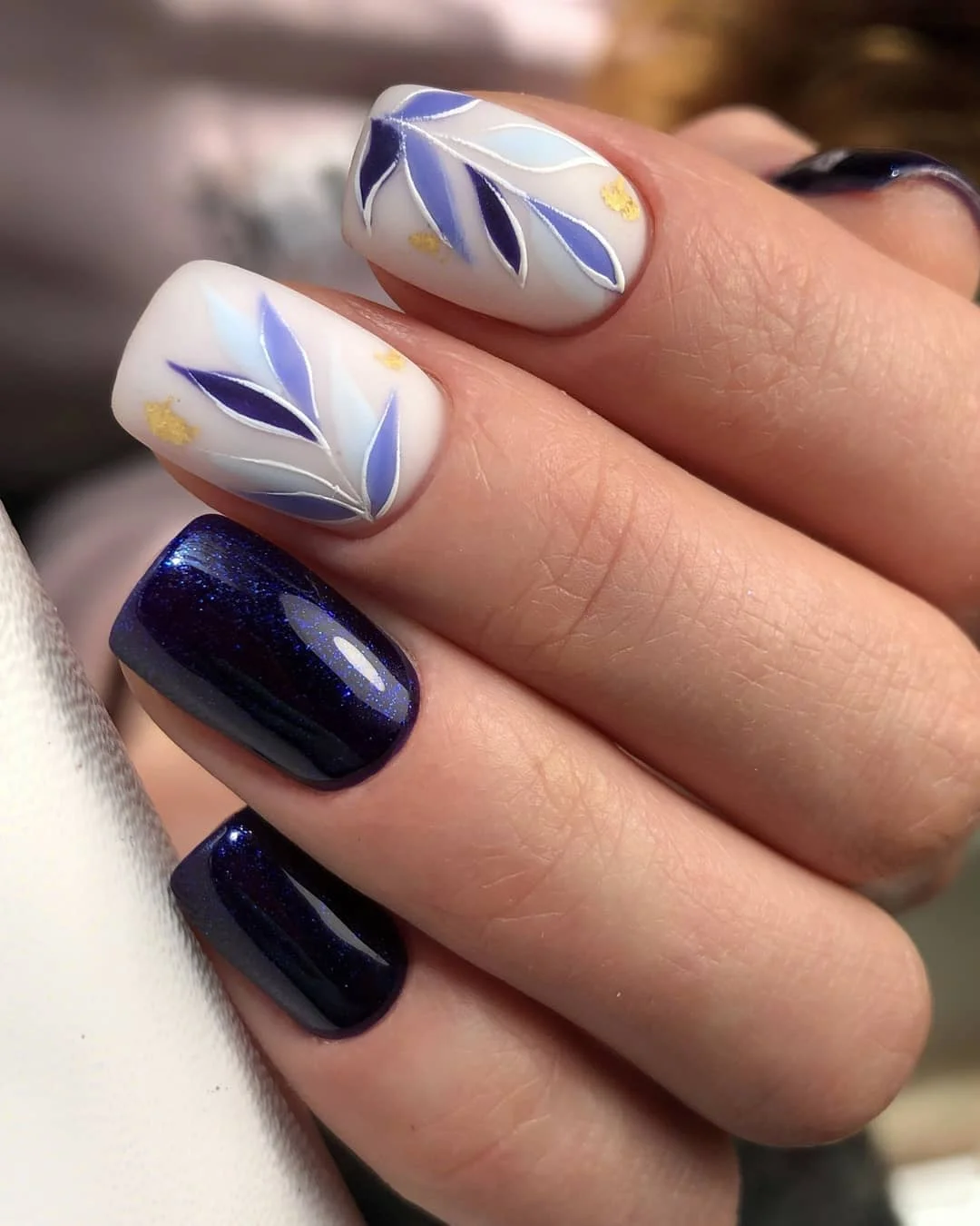 matte fall nails design 2026 Midnight Blue And Icy Botanical Nail Art