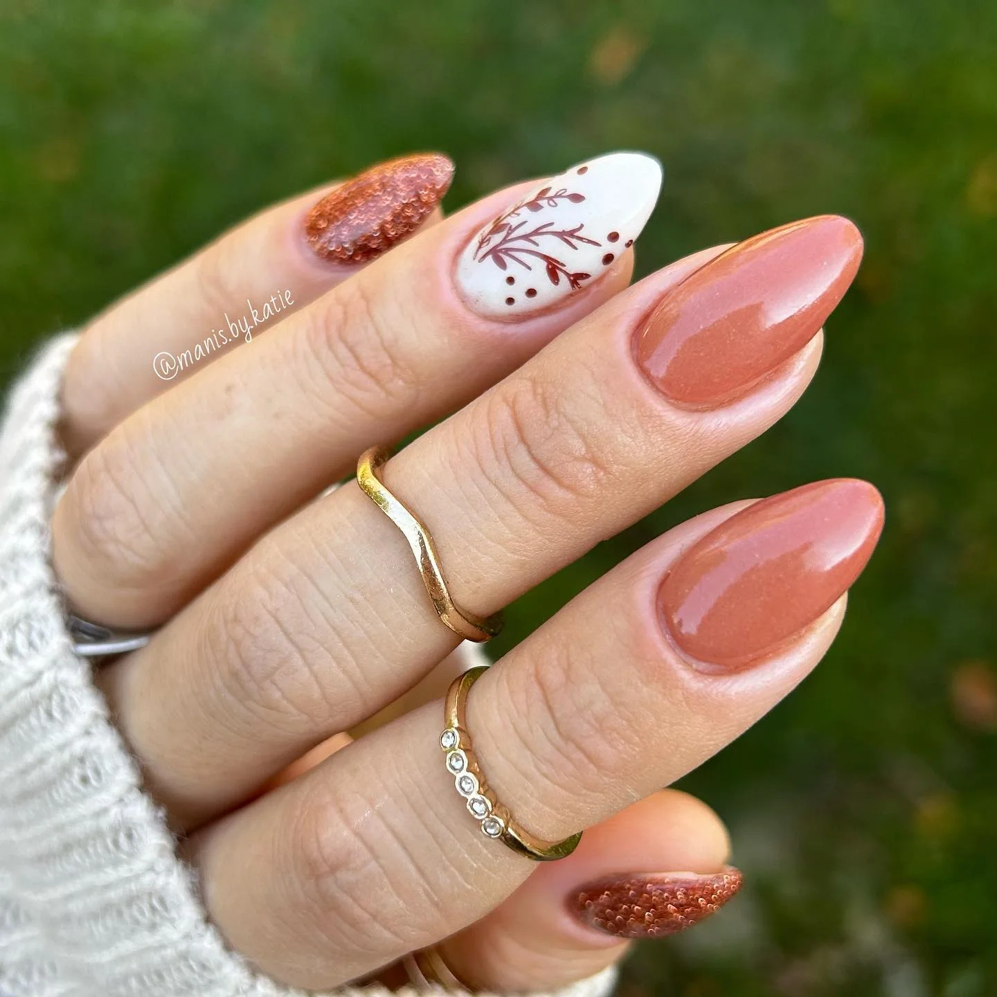 fall dip nails 2026 Terracotta Almond Nails With Botanical Accent