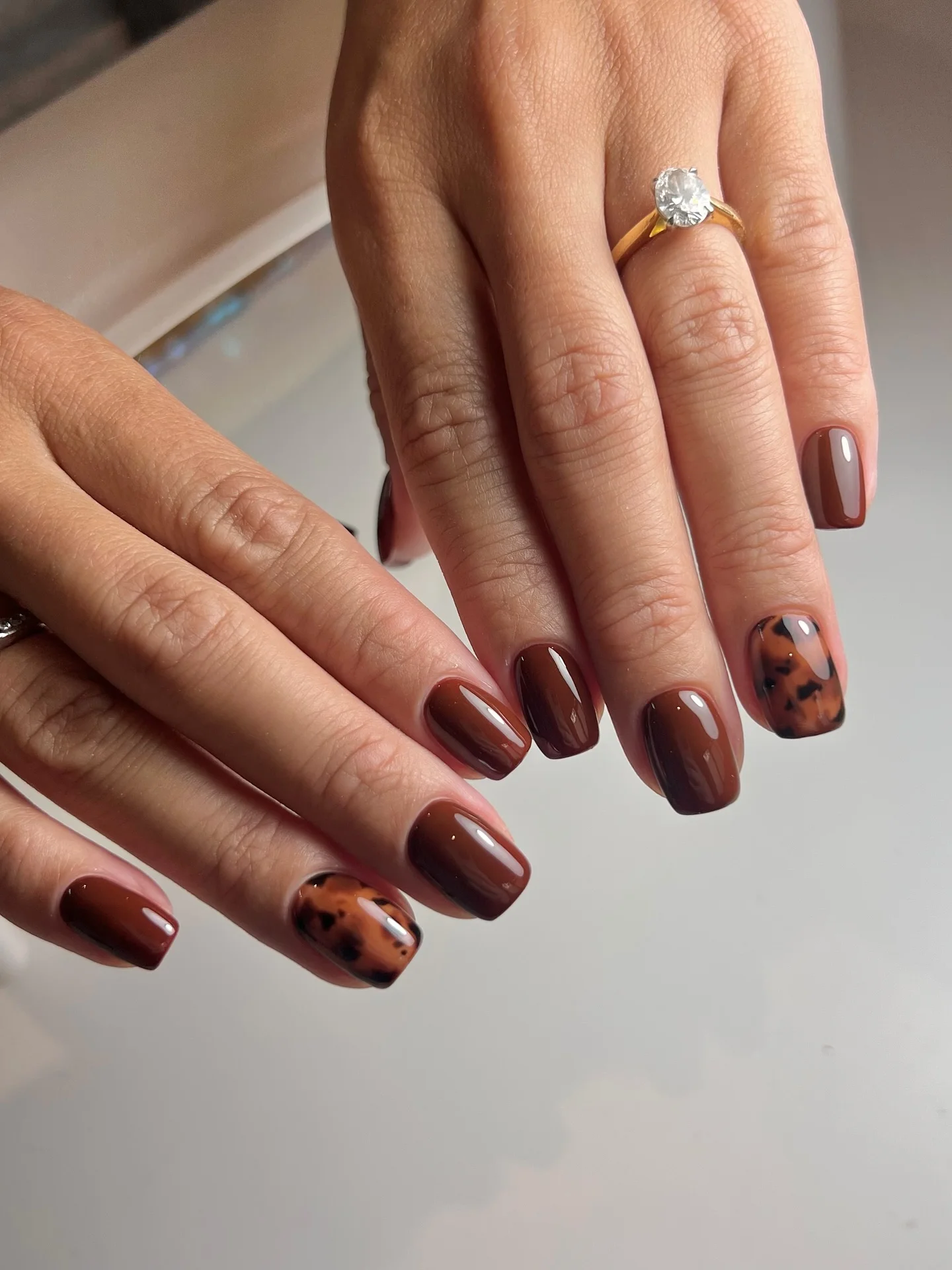 fall manicure ideas 2026 Glossy Chocolate Tortoiseshell Accent Nails