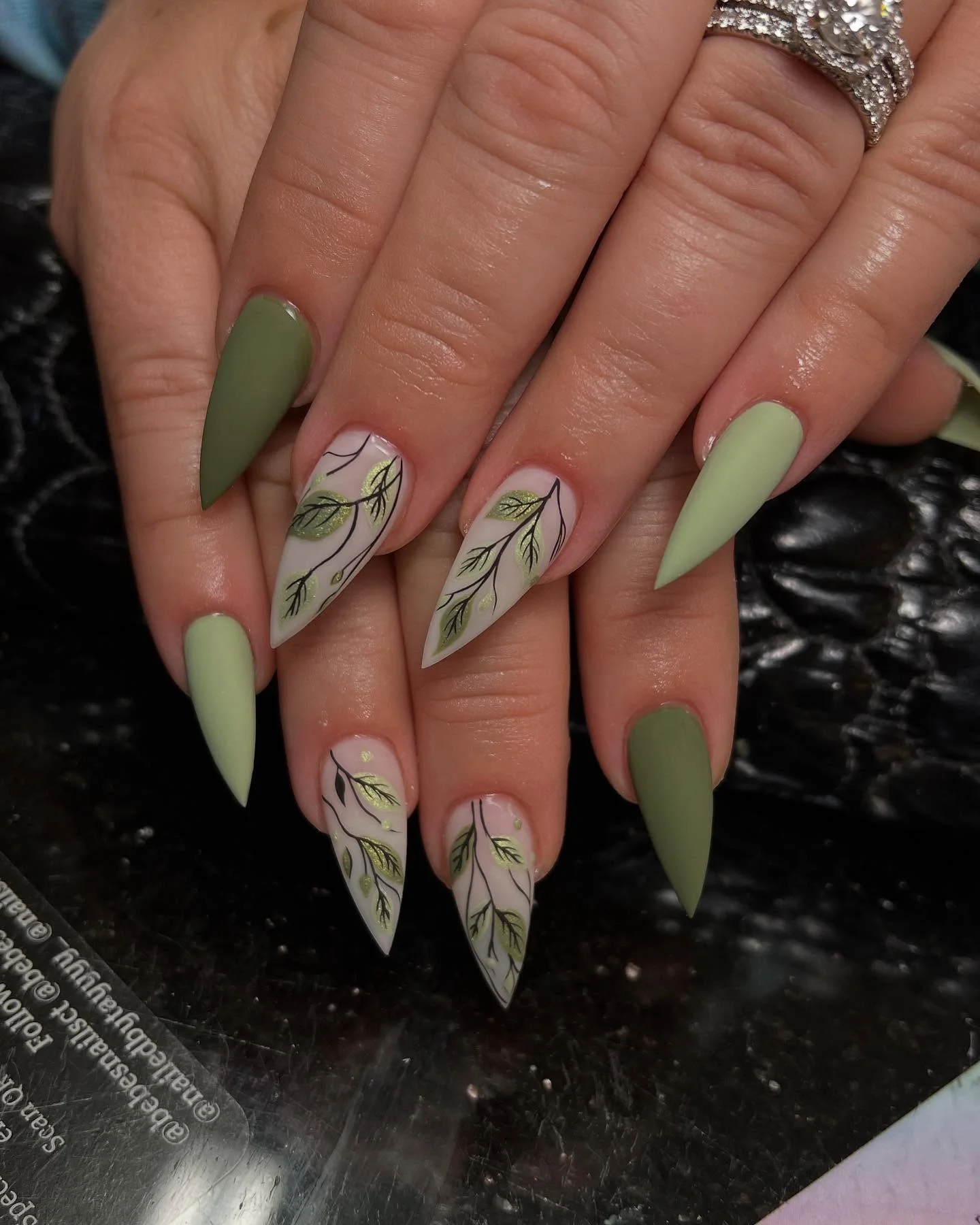 fall matte nails 2026 Muted Green Almond Nails With Botanical Gold Accents