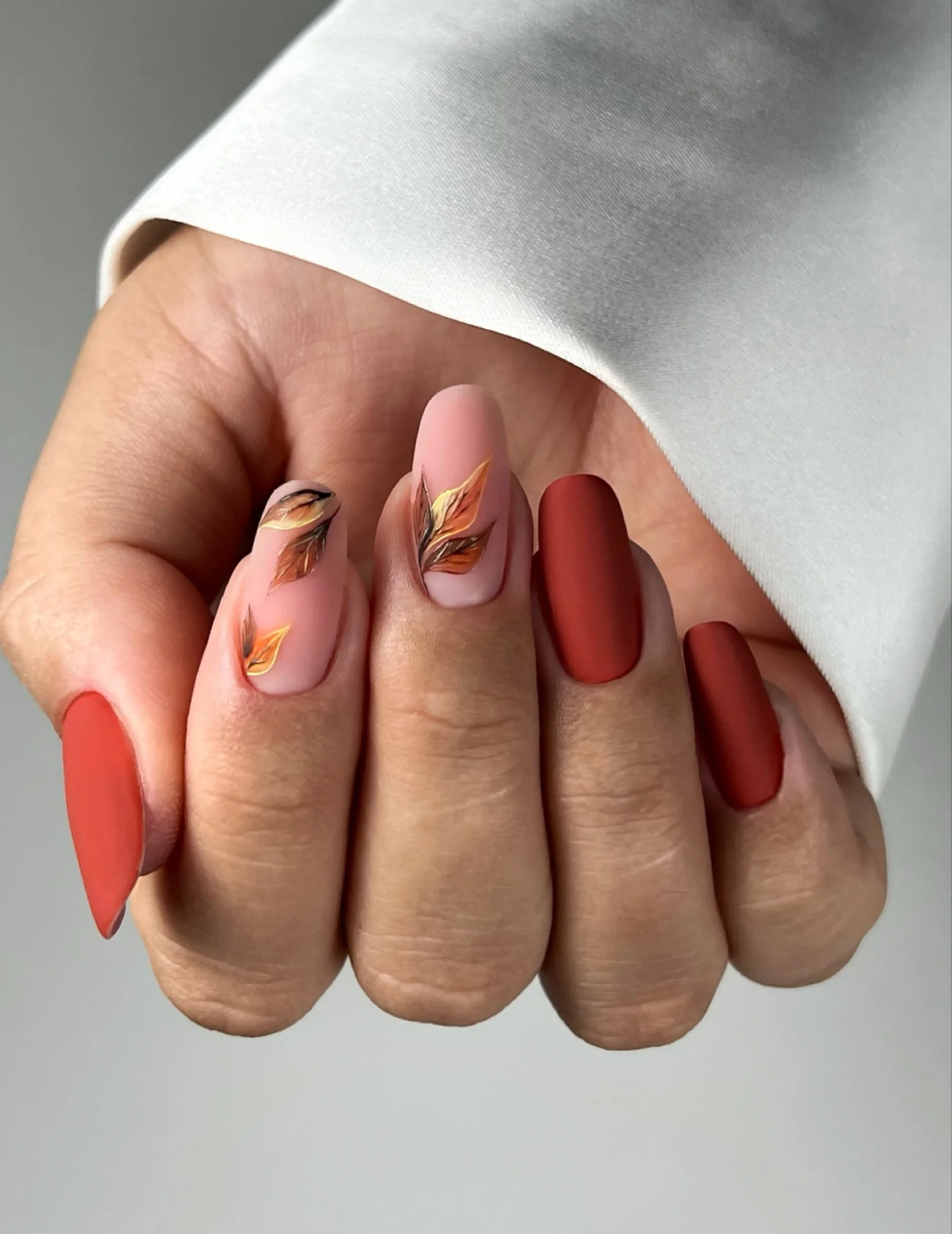 fall mid length nails 2026 Burnt Terracotta Nails With Elegant Autumn Leaves