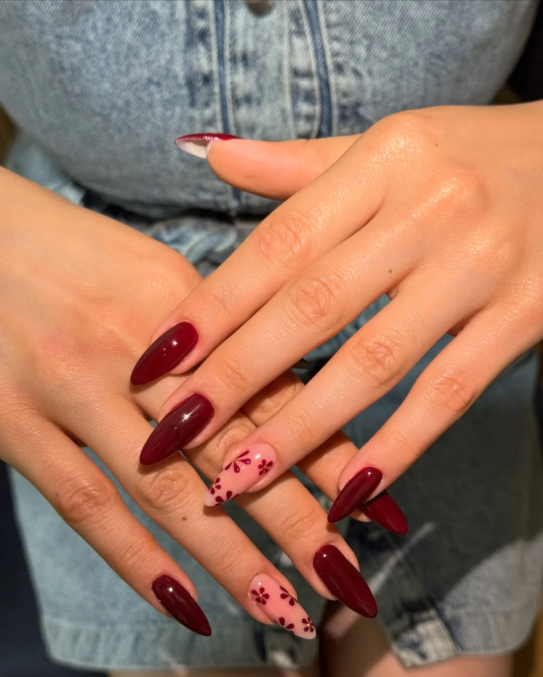 fall nail trends 2026 Deep Cherry Almond Nails With Delicate Floral Details