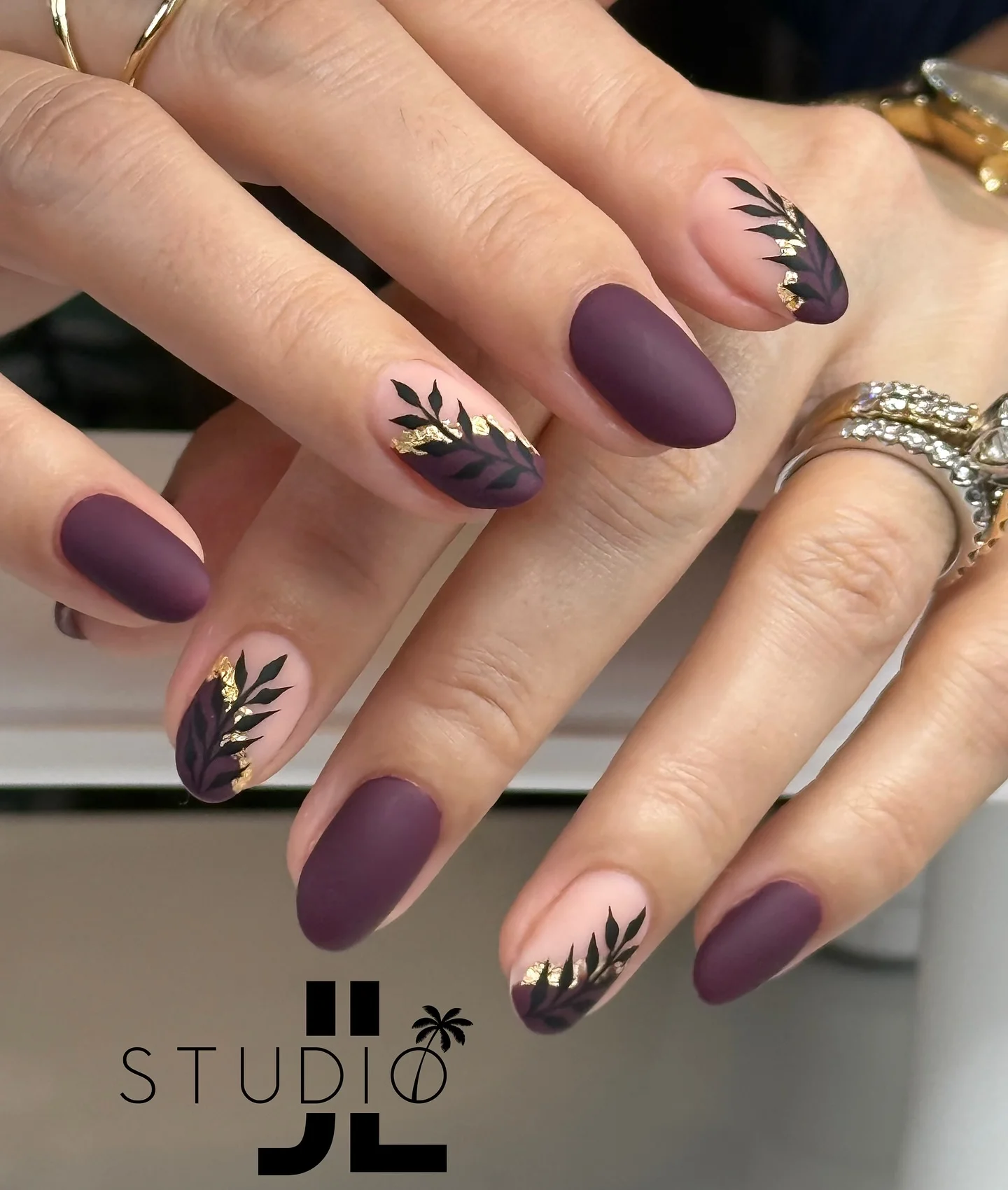 fall gel nails ideas 2026 Matte Plum Botanical Nails With Gold Details