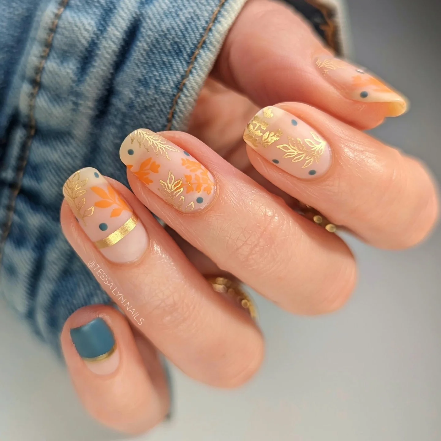 fall matte nails 2026 Peachy Nude Florals With Gold And Slate Blue Details