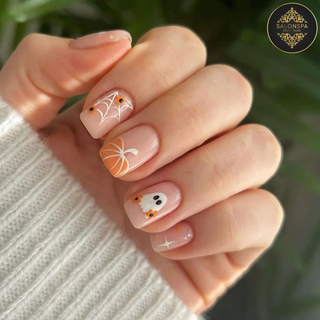 halloween nail art 2026 Delicate Nude Halloween With Ghosts And Spiderwebs