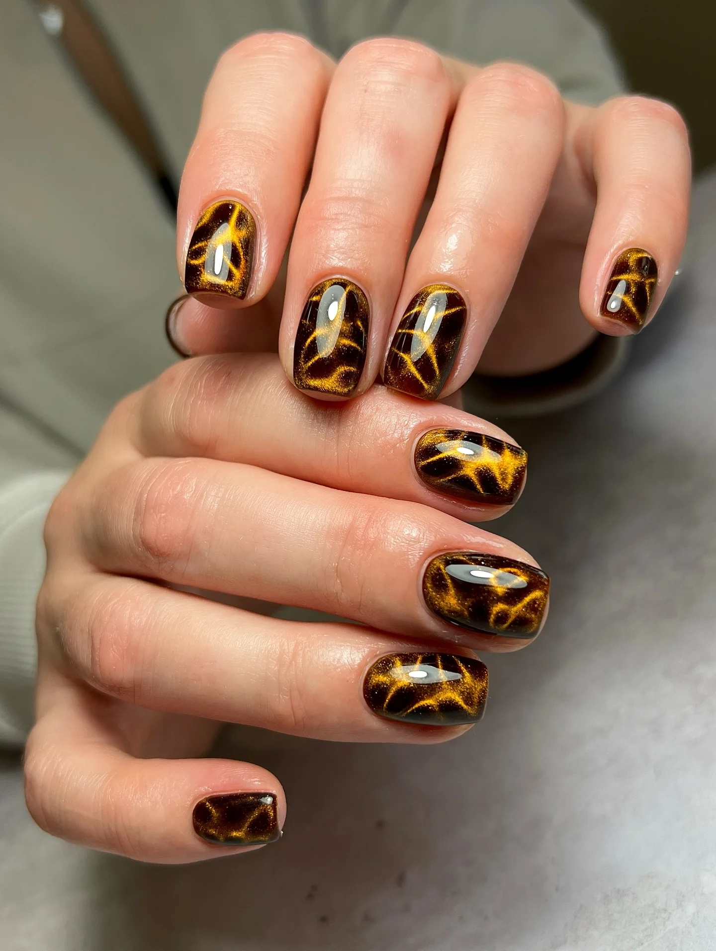 fall dark nail shadow ideas 2026 Amber Tortoiseshell Nails With Golden Dimension