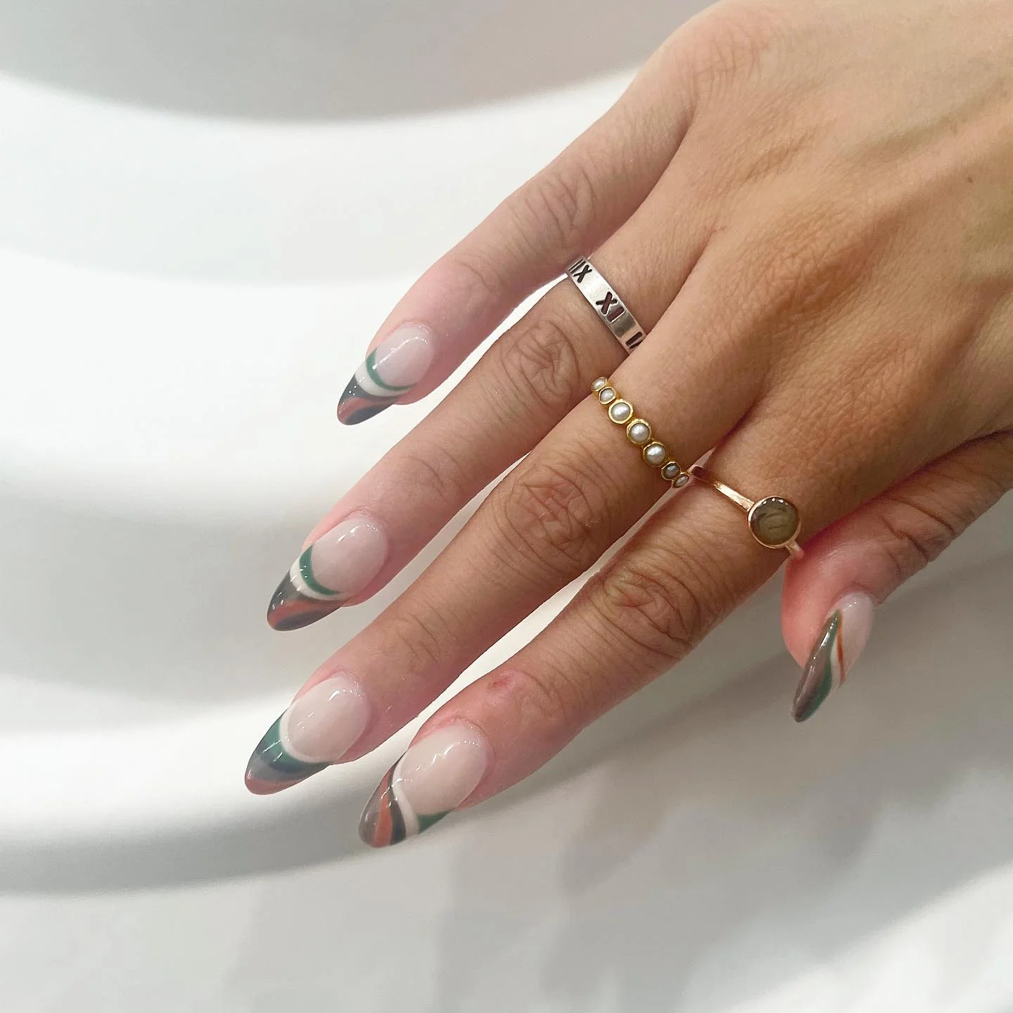 fall french nails 2026 Earth Tone Almond French With Modern Curved Accents
