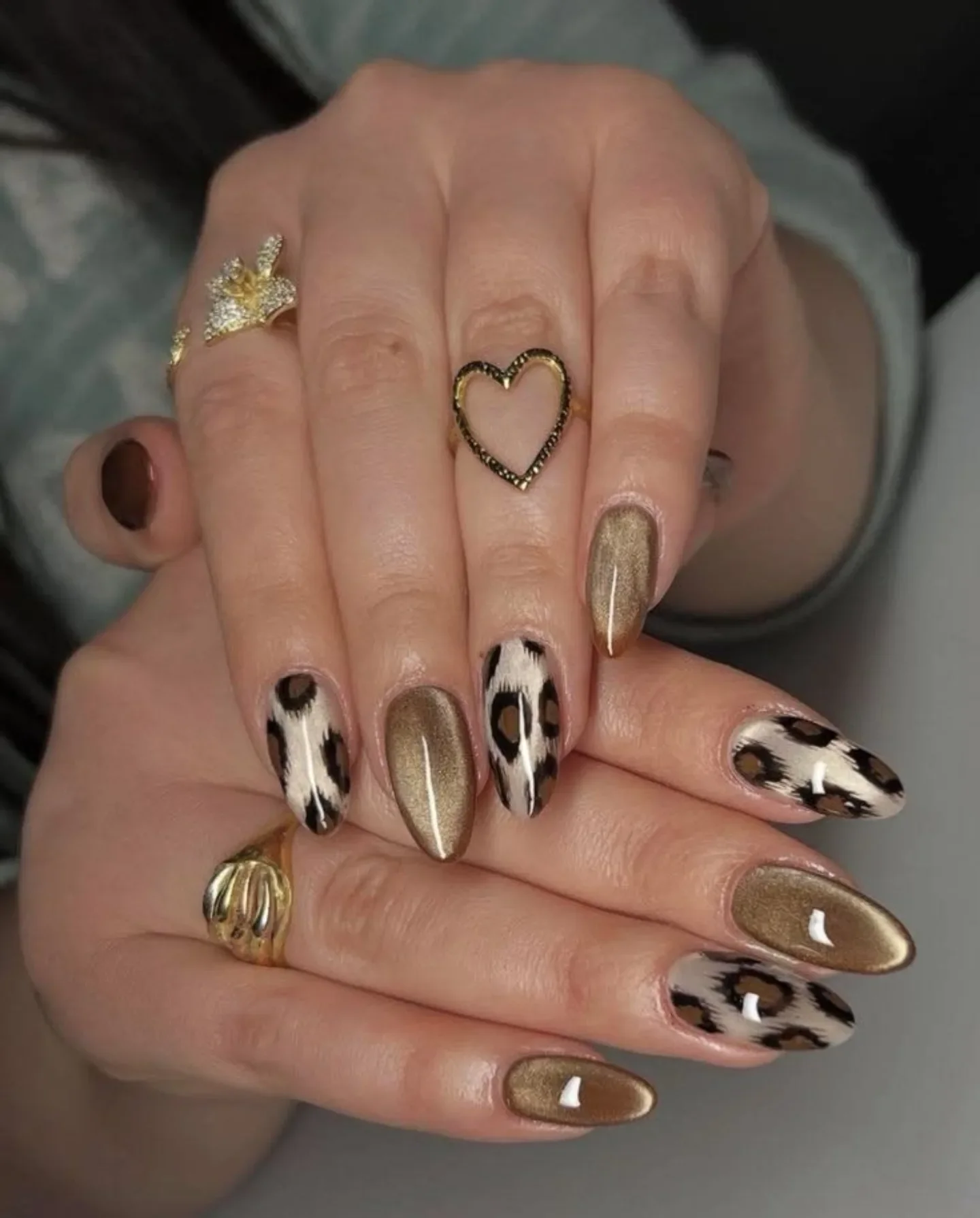 fall nail trends 2026 Bronze Cat Eye Nails With Chic Leopard Accent Art