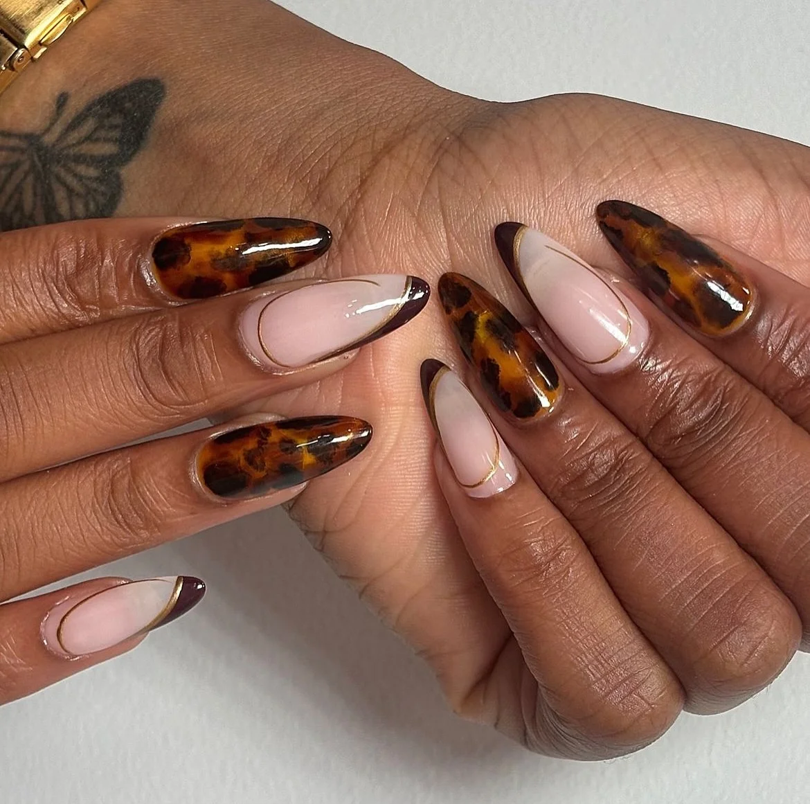fall nails for brown skin tone Tortoiseshell And Chocolate Almond Nails With Nude Framing