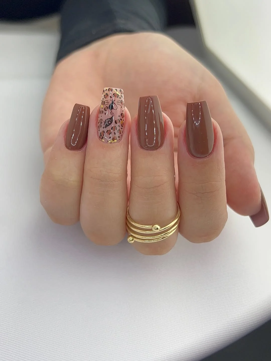 fall short coffin nails designs 2026 Glossy Chocolate Brown Coffin Nails With A Vintage Accent