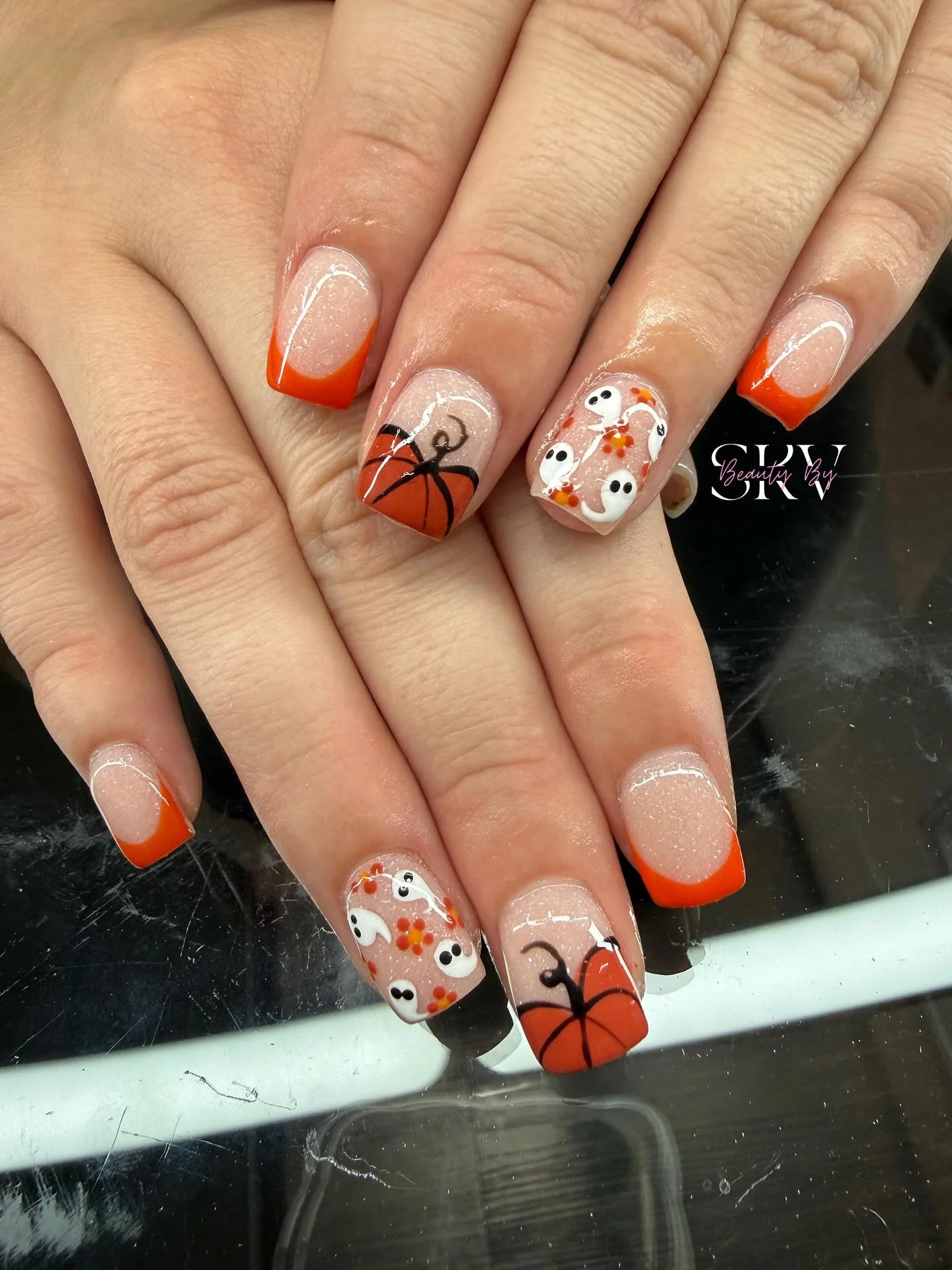 fall dip nails 2026 Pumpkin Orange French Tips With Playful Halloween Details
