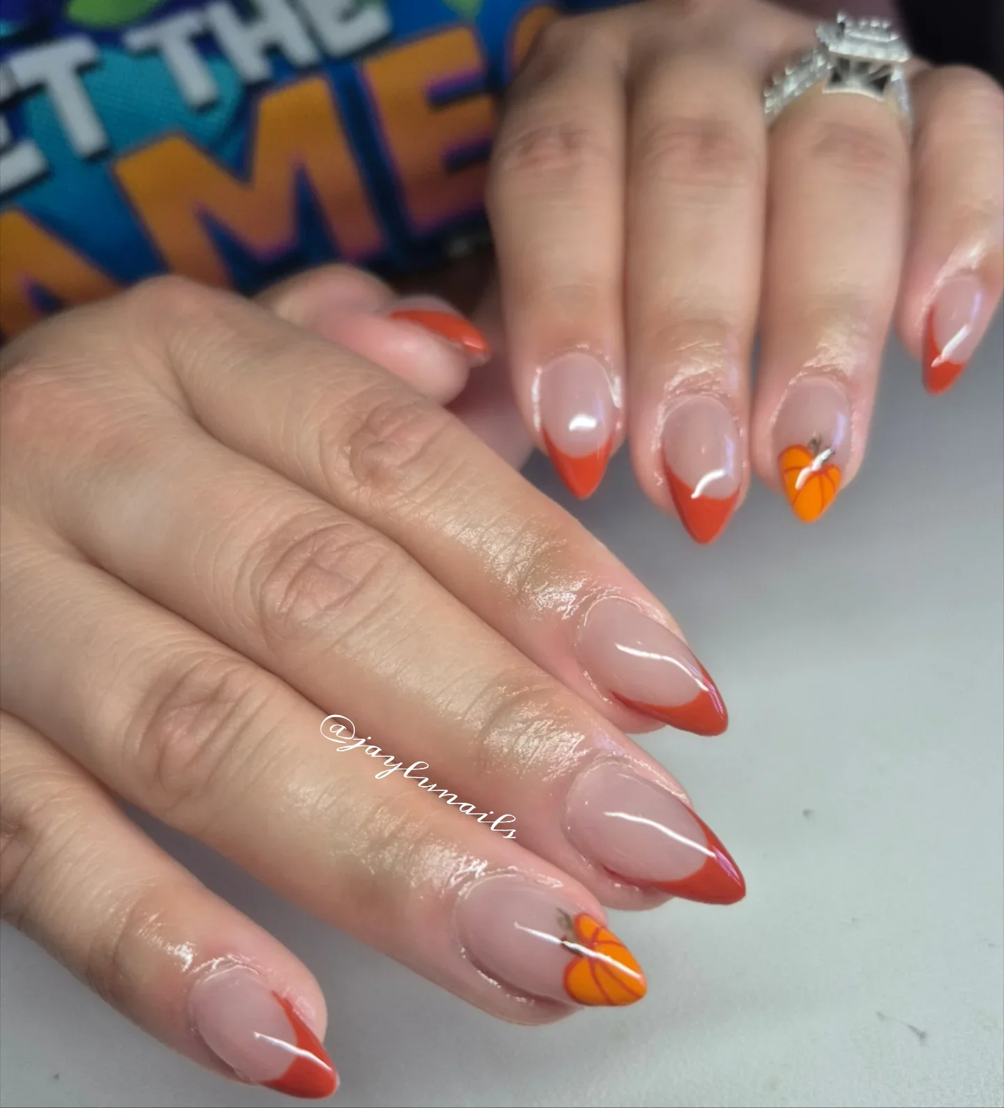 fall french nails 2026 Modern Pumpkin French Almond Nails