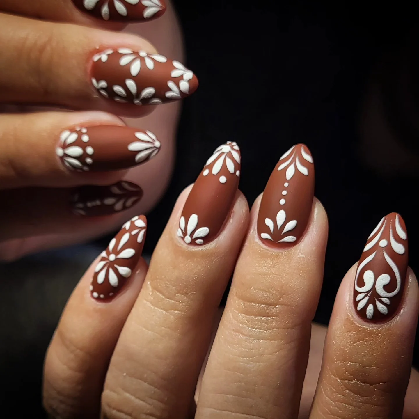 fall gel nails ideas 2026 Matte Cocoa Nails With White Botanical Details