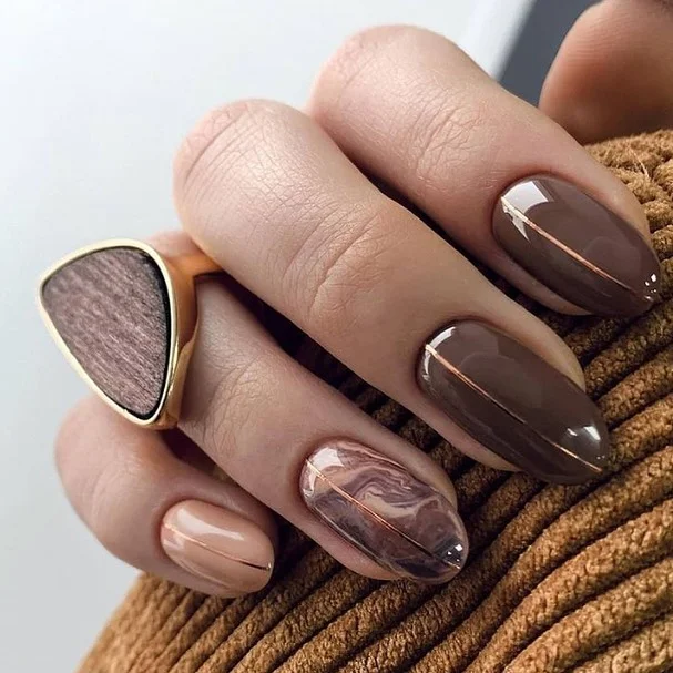 fall nails for olive skin tone 2026 Glossy Chocolate Brown With Marble Accent
