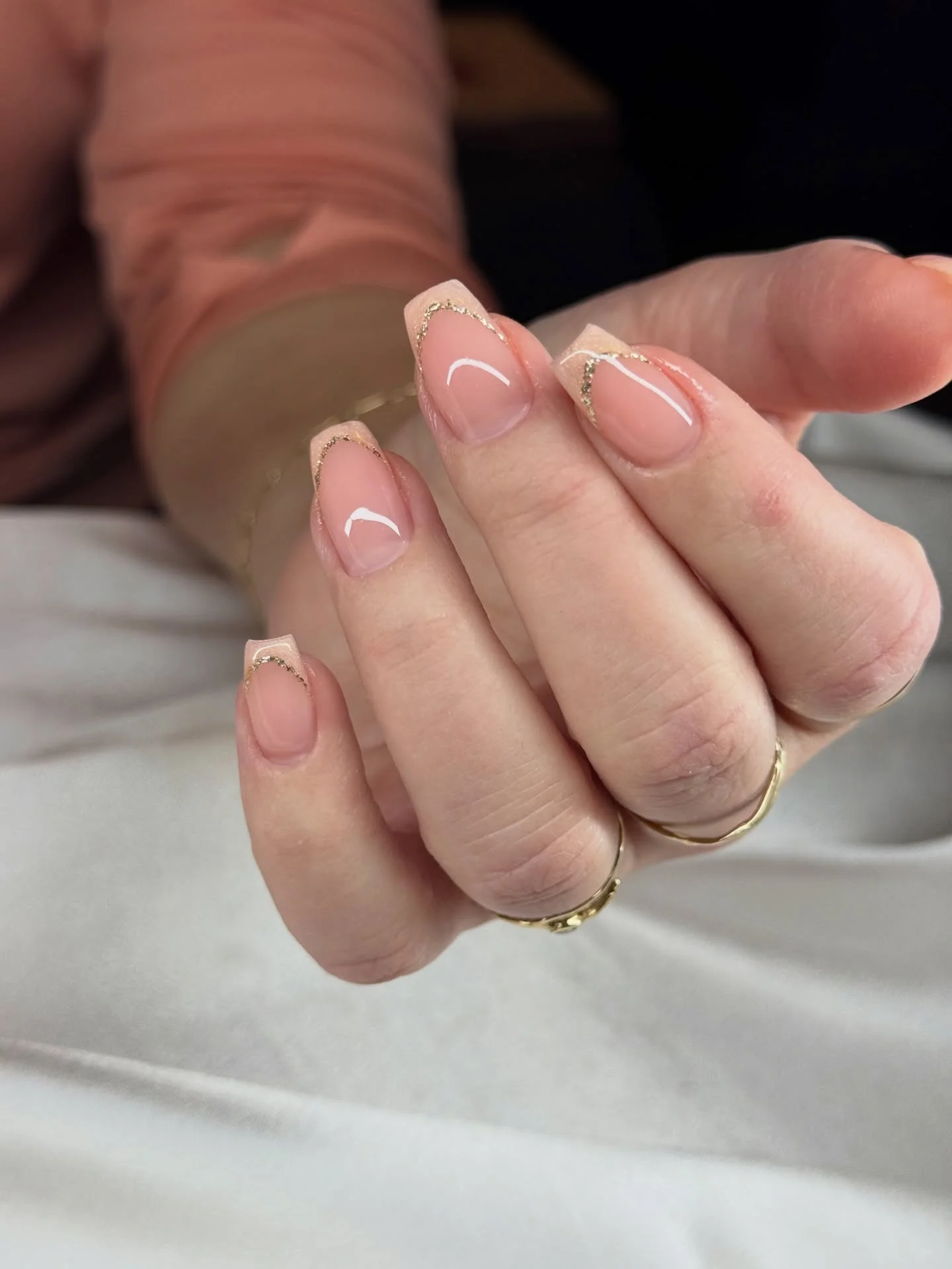 fall short coffin nails designs 2026 Sheer Pink French Tips With A Fine Gold Edge