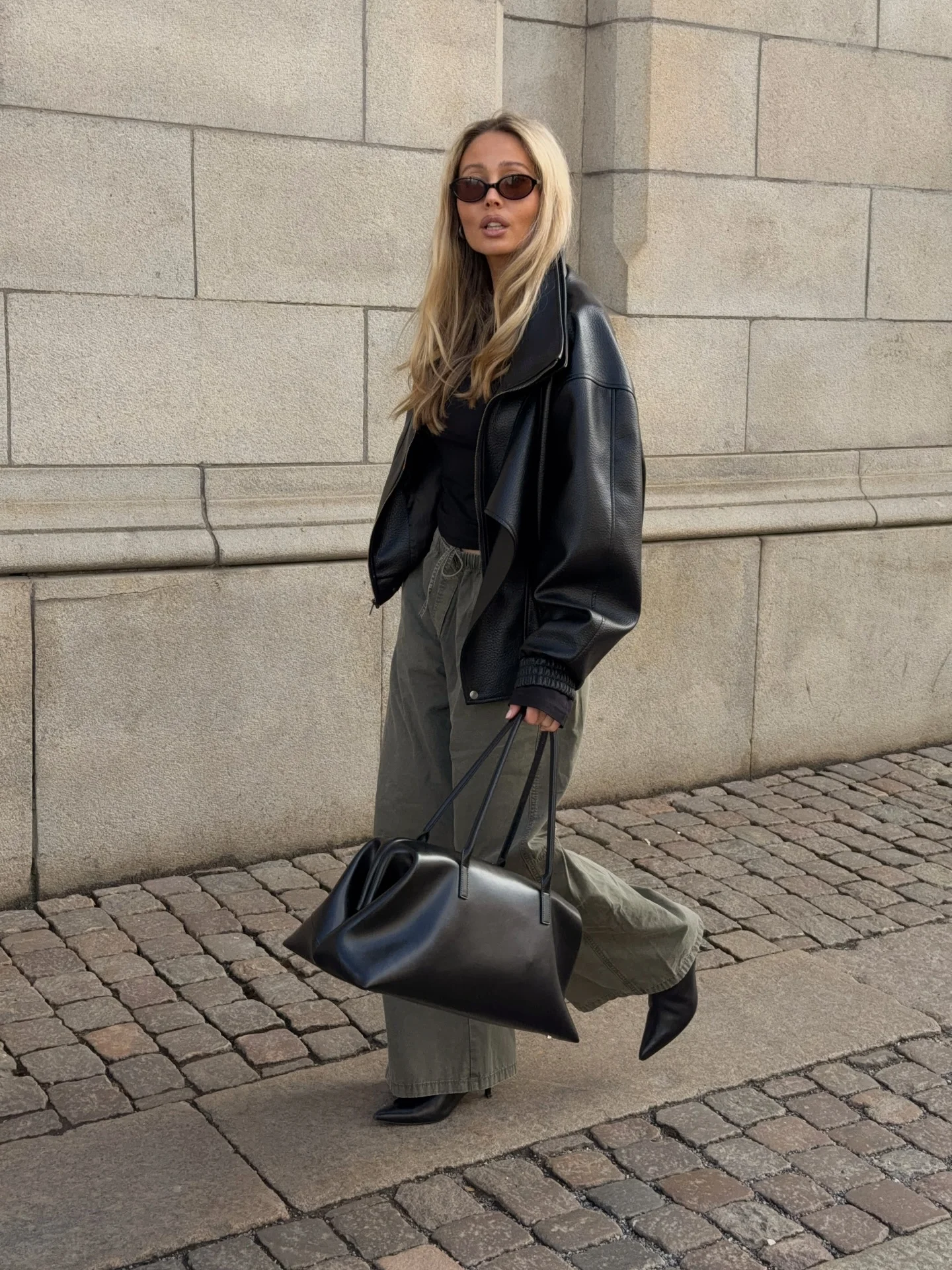september outfit ideas 2026 Black Leather Jacket With Relaxed Olive Trousers