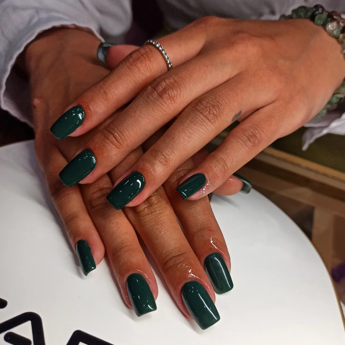 fall manicure colors 2026 Dark Forest Green With A Clean Glossy Finish