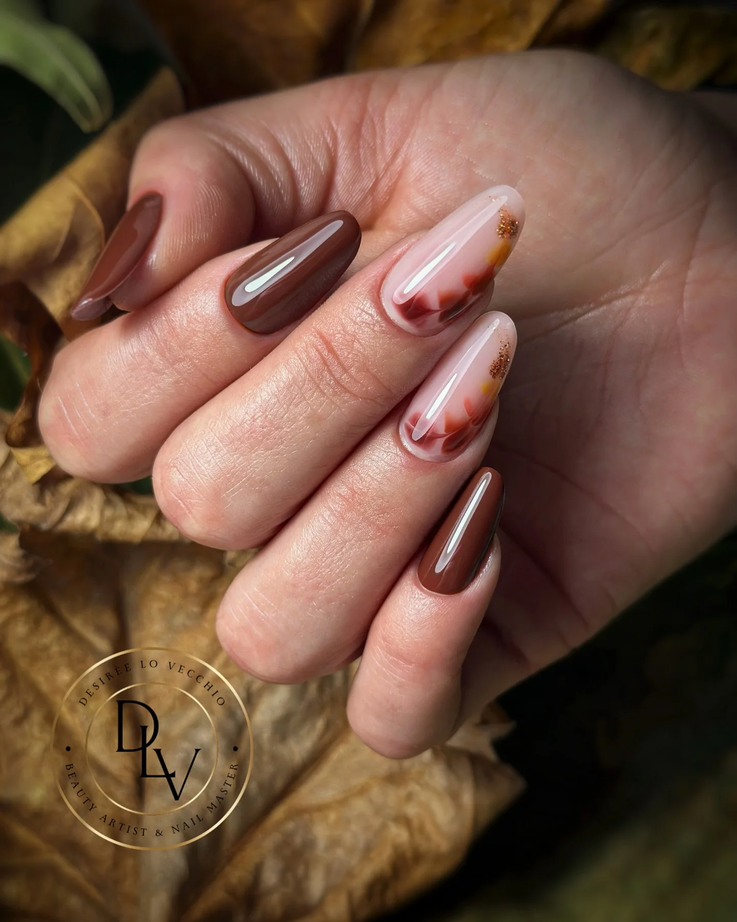 fall manicure ideas 2026 Glossy Cocoa Almond Nails With Abstract Autumn Art