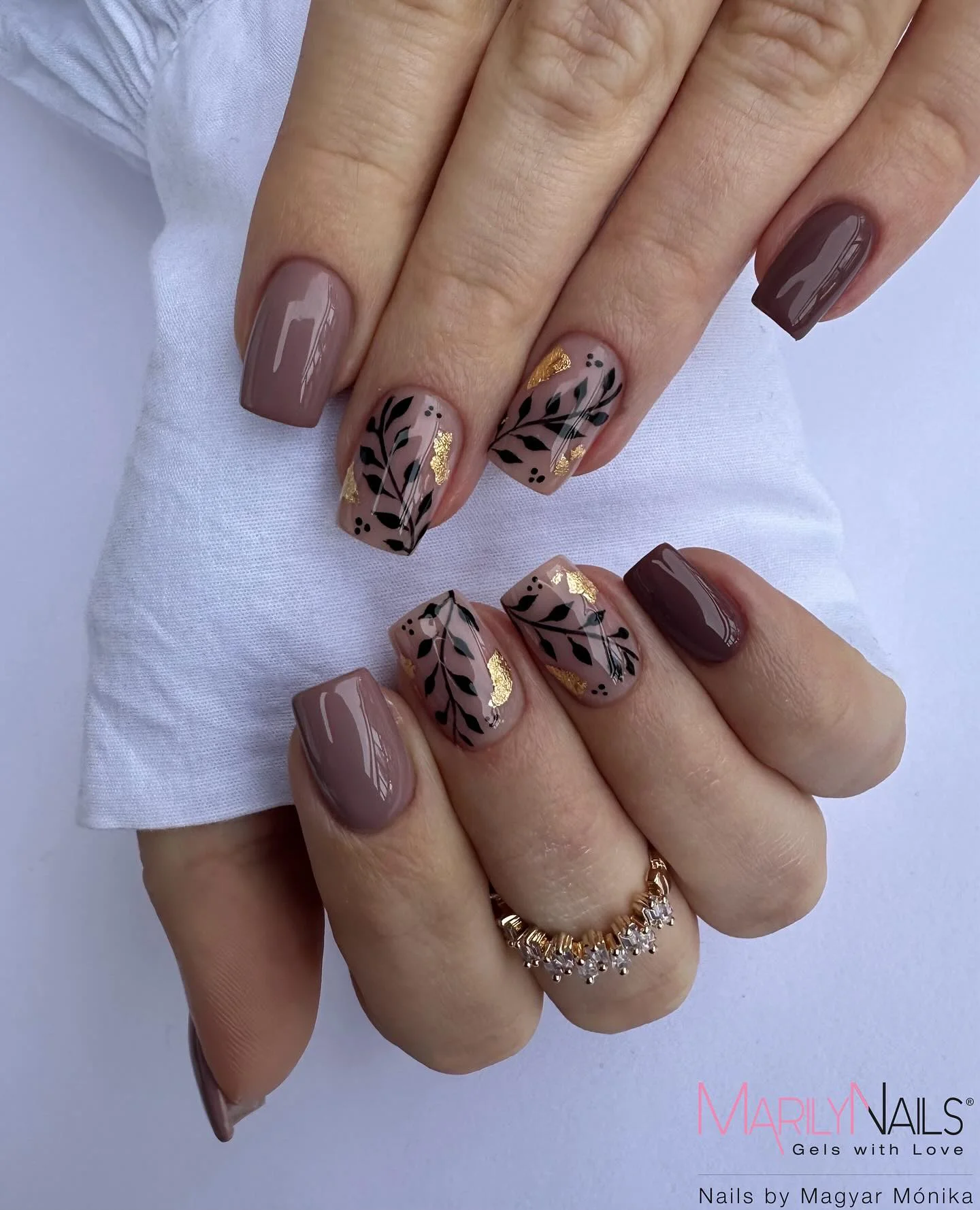 fall medium length nails 2026 Taupe Neutrals With Botanical Black And Gold Art