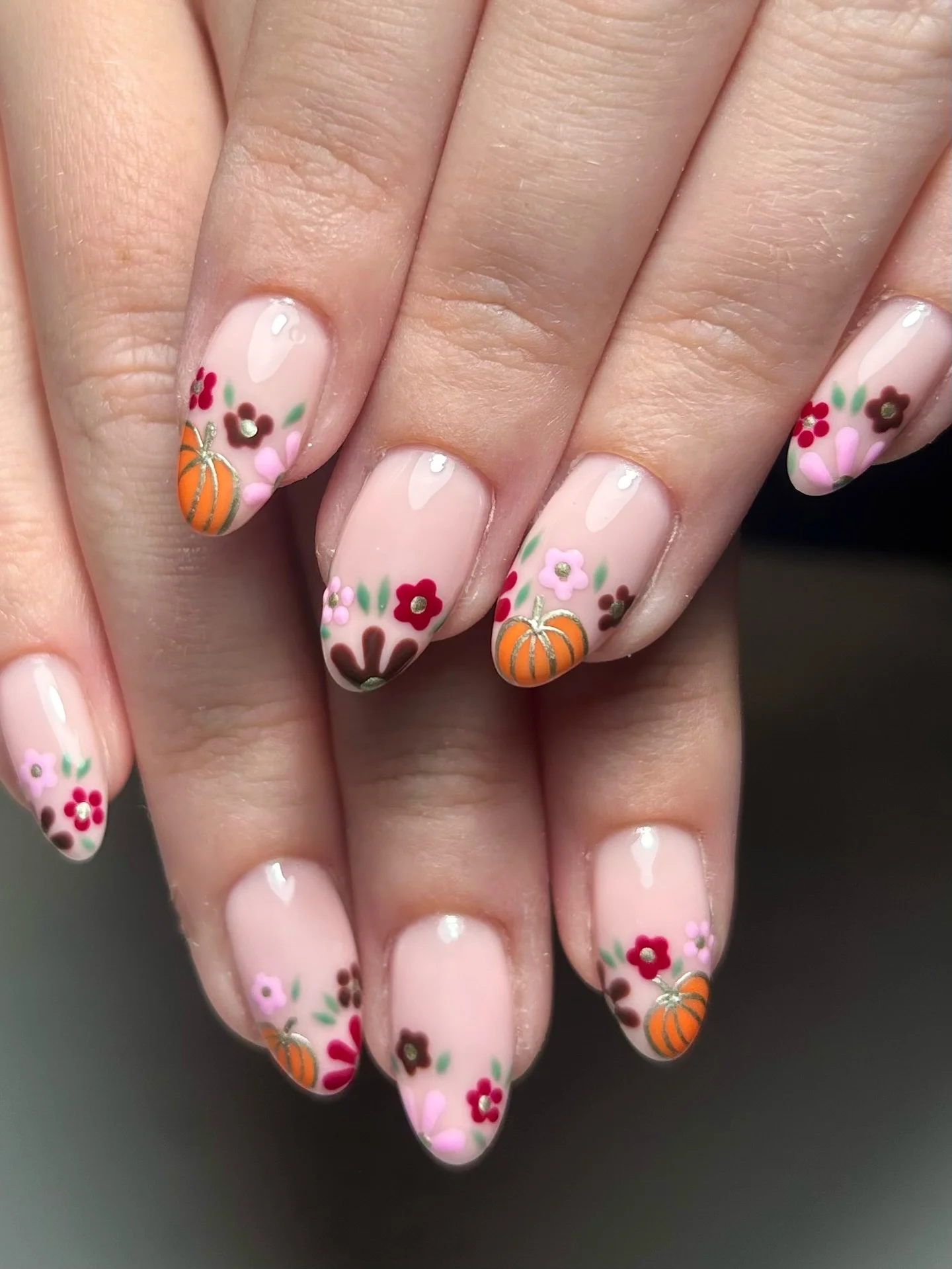 fall nails for pale skin 2026 Delicate Pumpkin And Floral Details On A Blush Nude Base